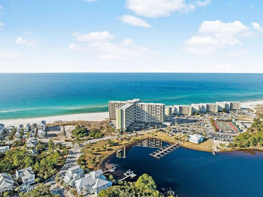 A1 PH 14 Perched on the west end of Panama City Beach, adjacent to Lake Powell, Pinnacle Port offers some of the most breathtaking coastal views imaginable. This two-level penthouse condo is a rare find, boasting an ideal layout with two bedrooms and full baths upstairs, while the kitchen, living/dining area, and master suite are conveniently located on the lower level.