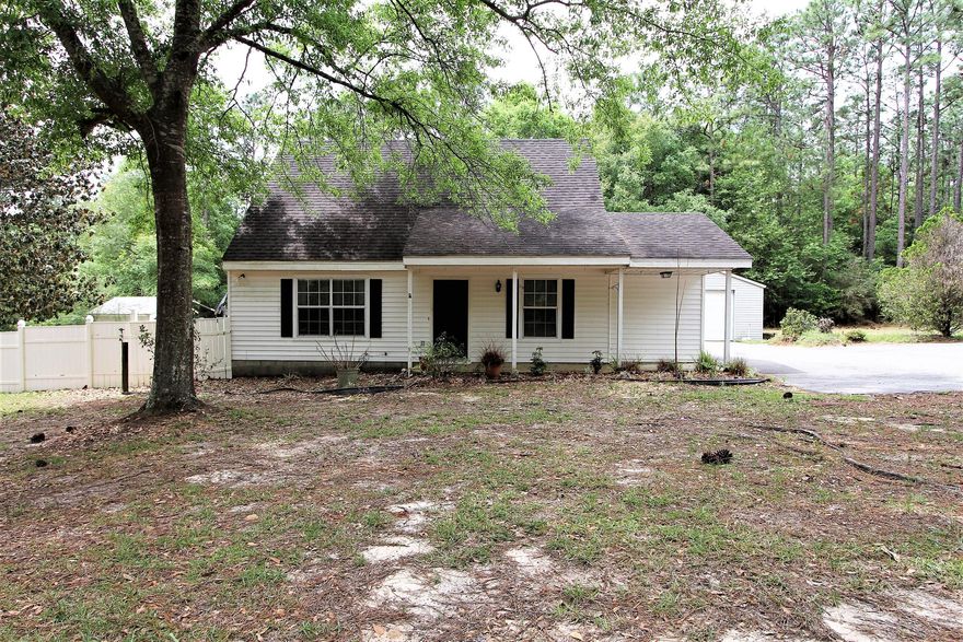 Cozy 3 bed, 2 bath Florida cottage just outside of town situated on 1.49 acres! This home is ready for a new owner to give it some TLC and make this cute home shine! There is a private pool with a sundeck, an oversized 2 car garage, a lovely screened in porch, a huge yard with plenty of room for your camper, ATV's, or boat.  There is plenty of storage in the home and in the detached  garage and the shed next to the pool. Home has public water with private well, and loads of potential!