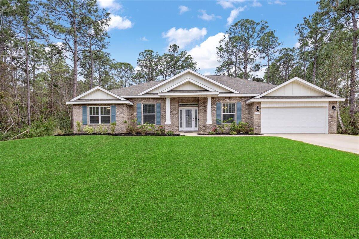Modern Elegance Meets Coastal Comfort in Navarre's HBTS Community. Step into luxury with this stunning 3-bedroom, 2-bath home built in 2023 by Whitworth Builders Inc. (includes transferable 10yr Structural Warranty by Maverick). Designed with an open-concept Caymate Key II floor plan, this 2,151sqft. residence offers both functionality and sophistication--featuring a flex room and a dedicated dining space to accommodate your lifestyle needs. At the heart of the home, the chef's kitchen shines with a large granite island, backlit cabinetry, and an effortless flow into the spacious living area. Towering 10-ft ceilings and E-glass windows create an airy ambiance, flooding the space with natural light and offering peaceful backyard views. Retreat to the primary suite, where a double vanity, a deep soaking tub, and a signature zero-entry walk-in tile shower set the tone for relaxation. Custom built-in closet organization adds a refined touch, ensuring both luxury and practicality.
Located in the sought-after Holley by the Sea community, this home provides exclusive access to world-class amenities- including a private beach and boat launch, three pools, a fitness center, and courts for tennis, basketball, and pickleball.
This is more than a home- it's a lifestyle. Schedule your private tour today!

