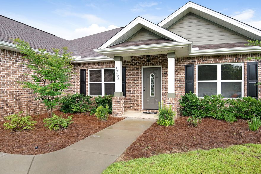 BEAUTIFUL HOME LOADED WITH AMENITITES ON ALMOST A HALF AN ACRE. The kitchen has beautiful cinnamon and ivory two toned Wellington cabinets and granite countertops. The sink and dishwasher are in the island which also has bar seating perfect for entertaining and socializing. Oil rubbed bronze kitchen faucet accents the under mount stainless steel sink. Upgraded moldings add an elegant touch. The open floor plan allows you to be a part of gatherings no matter where you are, in the living room, kitchen or on back porch. There is a breakfast nook off of the kitchen and a formal dining room just off of the Kitchen