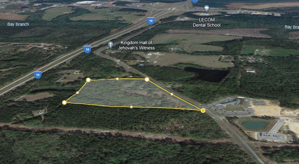 Discover a rare opportunity with this 15-acre parcel at 1152 Coy Burgess Loop, Defuniak Springs, Florida with over 1000ft of road frontage. Strategically located in close proximity to I-10 and Highway 331, this land offers endless possibilities. Recently cleared and brush-cut, the property showcases its natural beauty with mature trees and lush foliage. Unlock the potential of this prime location for your commercial venture, surrounded by the tranquility of nature yet seamlessly connected to major transportation routes.
