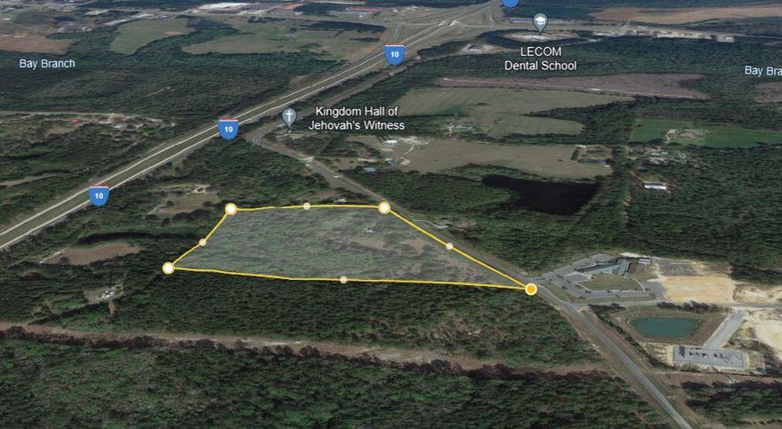 Discover a rare opportunity with this 15-acre parcel at 1152 Coy Burgess Loop, Defuniak Springs, Florida with over 1000ft of road frontage. Strategically located in close proximity to I-10 and Highway 331, this land offers endless possibilities. Recently cleared and brush-cut, the property showcases its natural beauty with mature trees and lush foliage. Unlock the potential of this prime location for your commercial venture, surrounded by the tranquility of nature yet seamlessly connected to major transportation routes.