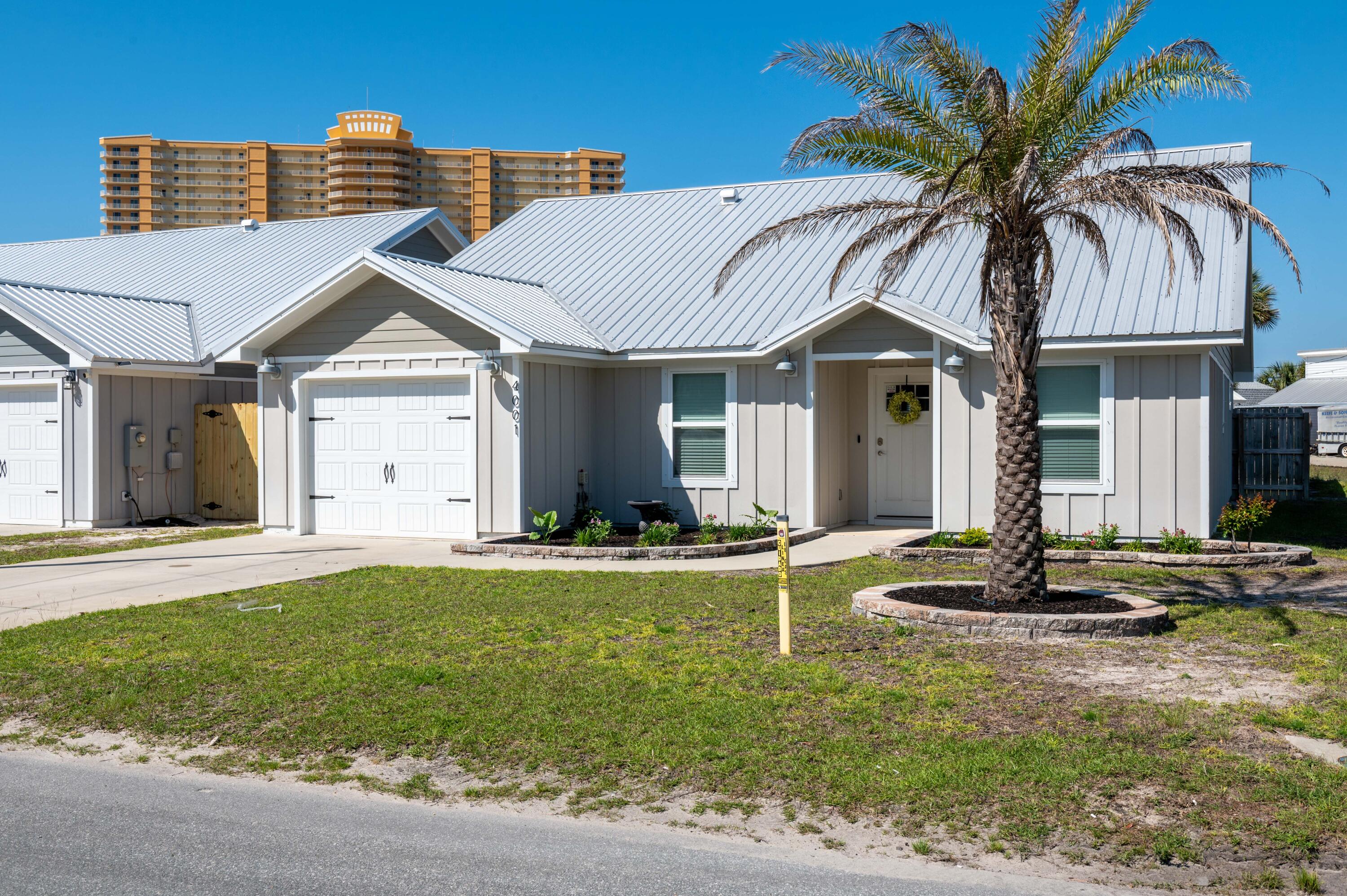 This nearly new Beach home is only 1000ft from Florida's Emerald Coast waters! Perfectly nestled in between some of Panama City Beach's staple restaurants, family fun attractions, bars, shops, & marinas; this home is within a 1/2 mile of three public beach accesses and a short golf cart ride to St Andrews State Park! It features LVP flooring (easy cleanup after beach days and sandy paws) high end appliances, and privacy fenced in backyard complete with pergola. With an open living/dining floor plan, along with three bedrooms and two full baths, this home is situated on a corner lot with plenty of parking and easy access to Thomas Drive. Does it get better? Yes! No HOA, no Flood Insurance required, and the home is on city water and sewer!