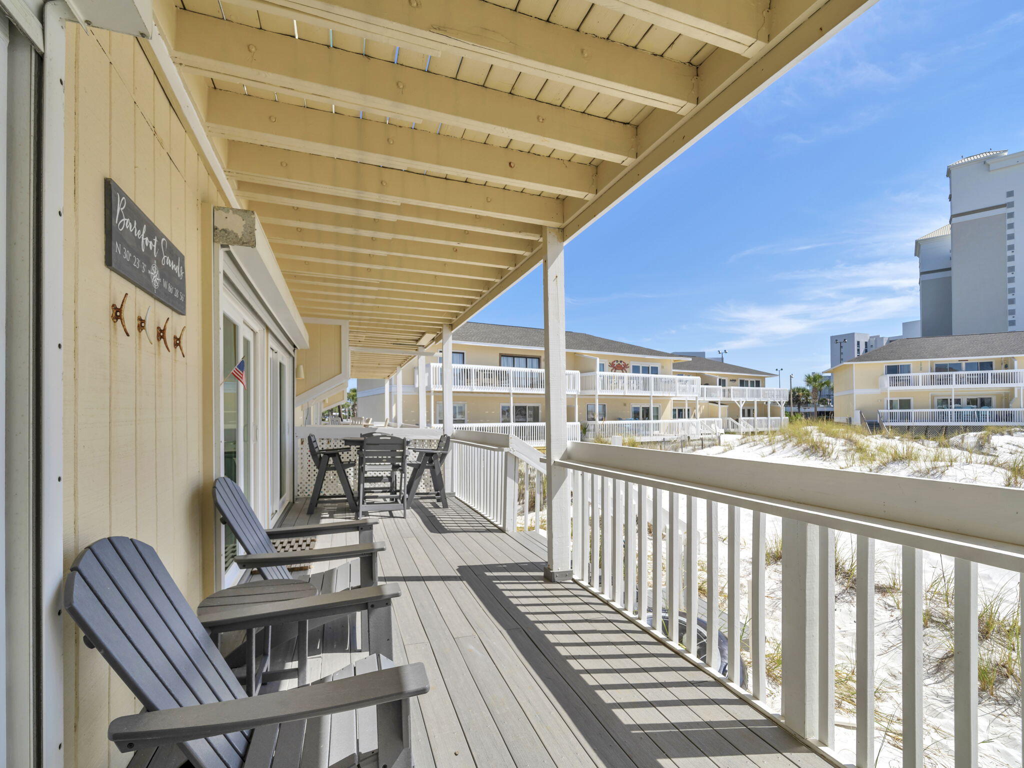 As soon as you leave the deck of this lovely beach condo you will be in the sand. Fully renovated and updated , chic and stylish. Stainless appliances, quartz counter tops, and attention to detail everywhere. Custom cabinets in the kitchen, hurricane shutters, and heavy duty storm rated sliding glass doors. Trex composite decking and Polywood brand high top outdoor furniture. Custom Birch ceiling in the hallway and kitchen. The HVAC was replace in June 2024 and has a digital thermometer with remote access. Ship lap, molding, planation shutters, USB outlets, and smooth ceiling make this condo stand out. Plenty of room for the whole family and you can also take advantage of vacation rentals. Many great amenities include tennis, chip and putt golf course, marina, and on site restaurant. Many fun attractions in the area. A complete list of all the upgrades and benefits are in the documents section.
