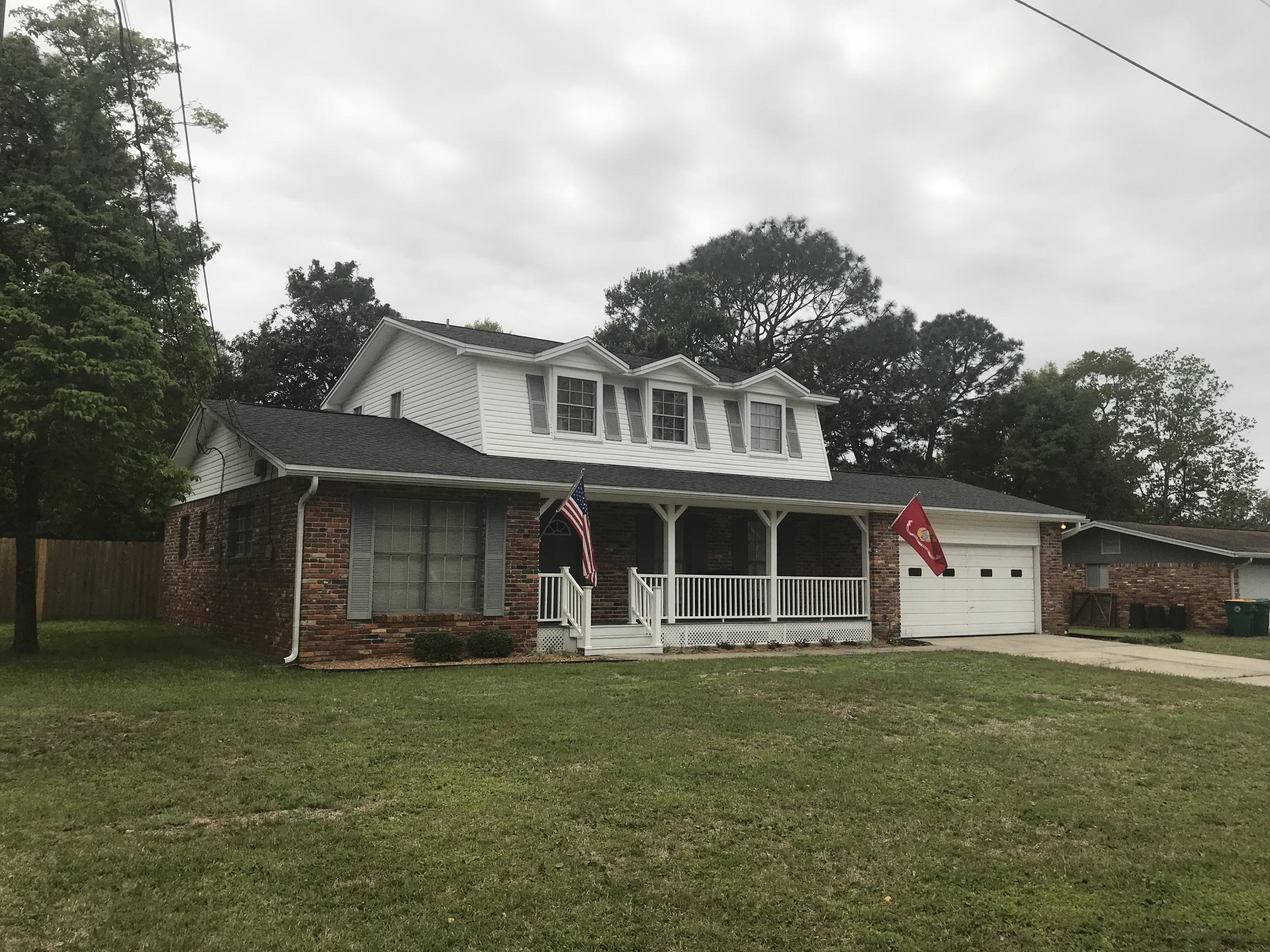Immaculate home in the most sought after community in Okaloosa County. This home features three full bathrooms, one bedroom on the main floor and additional bedrooms on the second floor. Huge back lawn for you children and pets. Rocking chair front porch. NEW paint and carpet. This home has a Great room and a Living room. Double garage, Balcony off the upstairs bedroom overlooks the private back lawn.