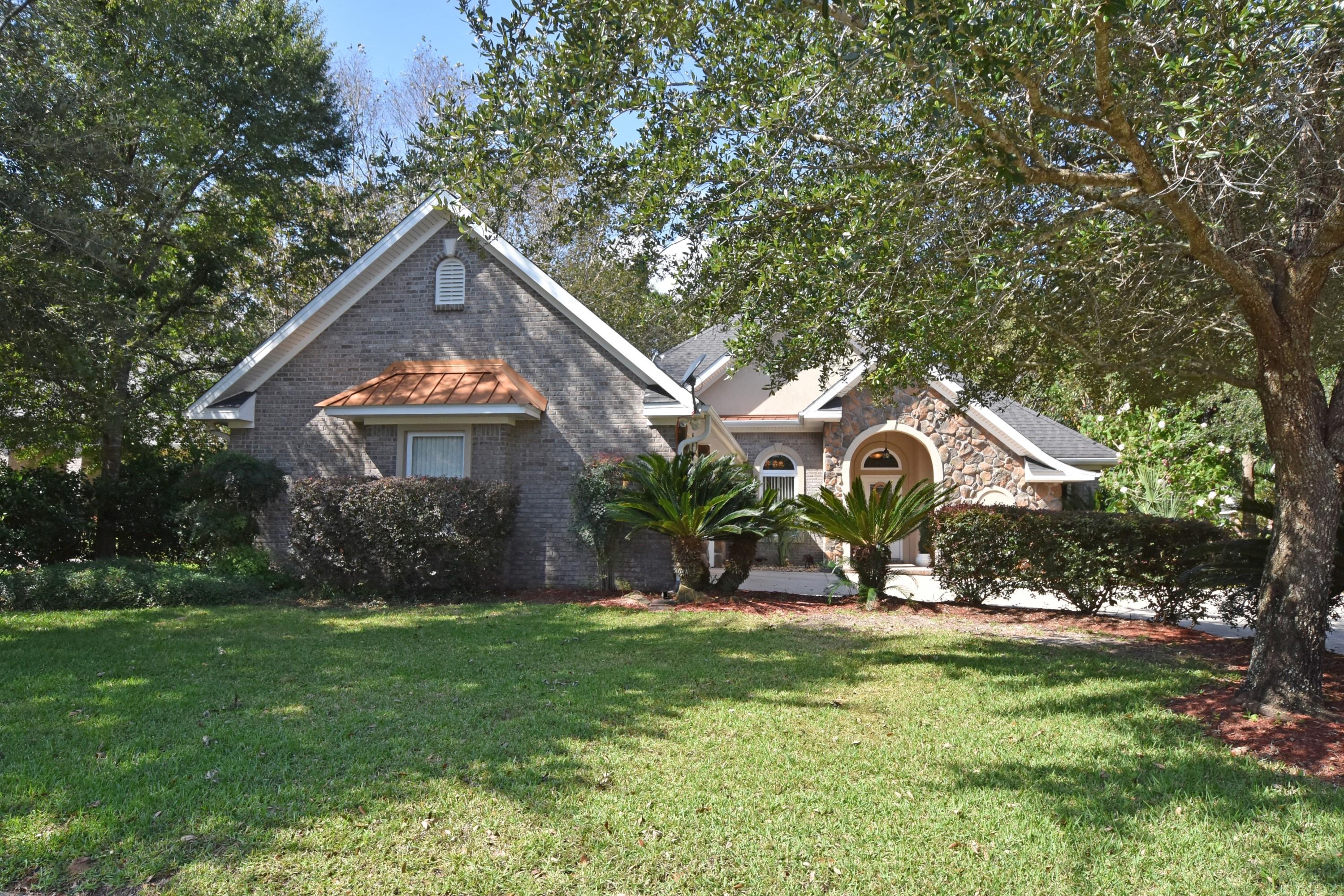 EXTRAS Galore!! Corner lot and private landscaping are perfect to enjoy your fenced back yard w/stone paver open patio and Florida Room. Crown Molding throughout w/12' ceilings in the main living areas. Open floorpan with natural lighting, 3 Bedrooms, Office, Formal Dining, Breakfast Nook, Florida Room, and 2 1/2 Bathrooms! Fully equipped Kitchen w/GAS Range, Granite tops, Oak Cabinets, Pantry, Breakfast Bar with a view to the Great Room. Tray ceiling in the Dining Room and Great Room w/corner gas fireplace and built-in cabinetry. Private Master Suite is located at the back of the house w/walk-in-closet, dual vanity, soaker tub, and walk-in shower. Bedrooms 2 & 3 share the Jack-n-Jill Bathroom w/a linen cabinet. Office is located next to the laundry room w/storage cabinets! See today!