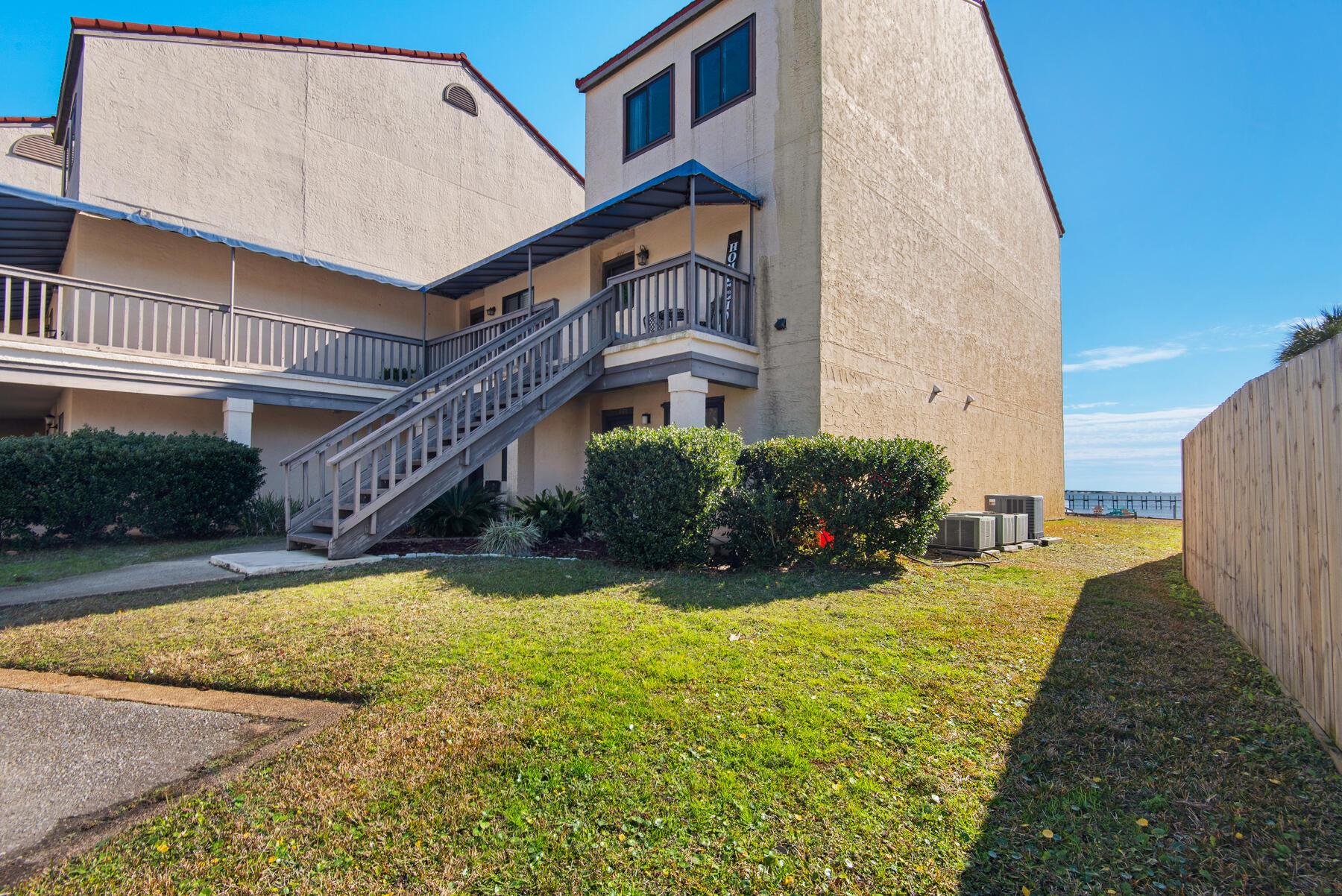 Enjoy waterfront living in Safe Harbour Village, just 2 miles from Navarre Beach! Light, bright, and airy, this two story condo boasts clear views of the Sound. Watch the sunrise and sunset over the water, from the comfort of your living room or bedroom. Updates include full interior paint, new appliances, and updated vanities. Tile throughout - no dealing with carpet! Head down to the pool and soak up the warmth of the sun while gazing at the captivating blue sky and water.