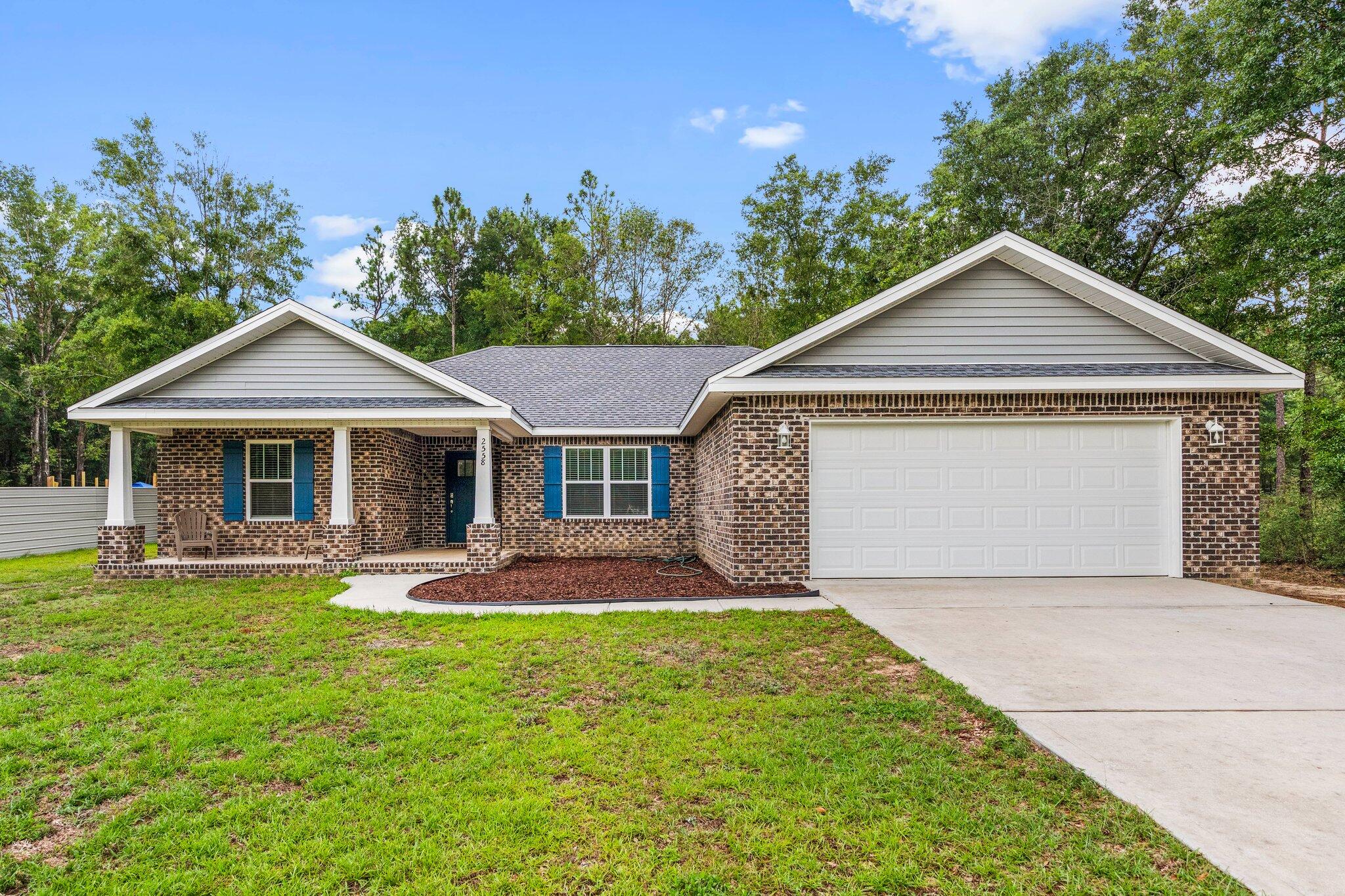 Welcome to this **PRISTINE** 4 BEDROOM, 2 BATH Home with 2 Car GARAGE on an OVERSIZED LOT! In this 2021 home you'll find a spacious living area with a large open kitchen featuring STAINLESS appliances, GRANITE countertops, and plenty of cabinet space with GRAY SHAKER Cabinets. The split floor plan ensures privacy, with the master suite including a WALK-IN Closet and a luxurious en-suite bathroom. The beautifully landscaped yard offers a peaceful retreat with room for a pool or garden. The attached 2-car garage provides ample storage.Centrally located to town, this home offers easy access to schools, shopping centers, and dining options, with major highways nearby. With tons of upgrades and low insurance costs ($800/year), don't miss the opportunity to call this fantastic property home.