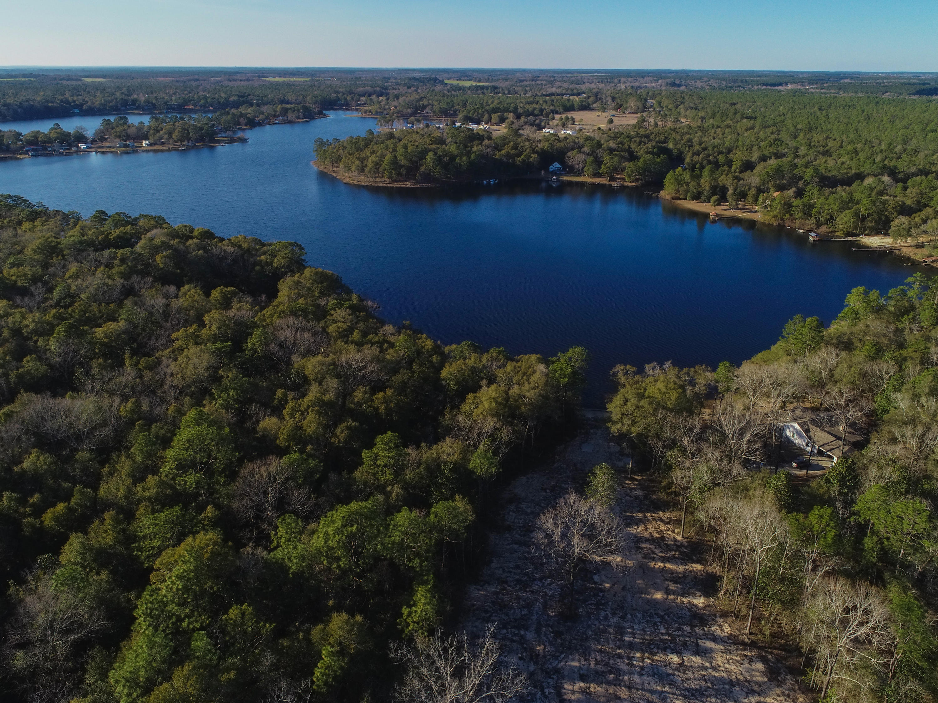 Fishing, swimming, day dreaming and camp fires. This estate sized lot of over four acres on Kings Lake in DeFuniak Springs beckons. Build your ''lake'' home, your getaway, and your private enclave. About 45 minutes to the beaches of South Walton and 30A, but remote enough to feel you are away. Buyer to perform own feasibility determination for desired use. We have a builder.