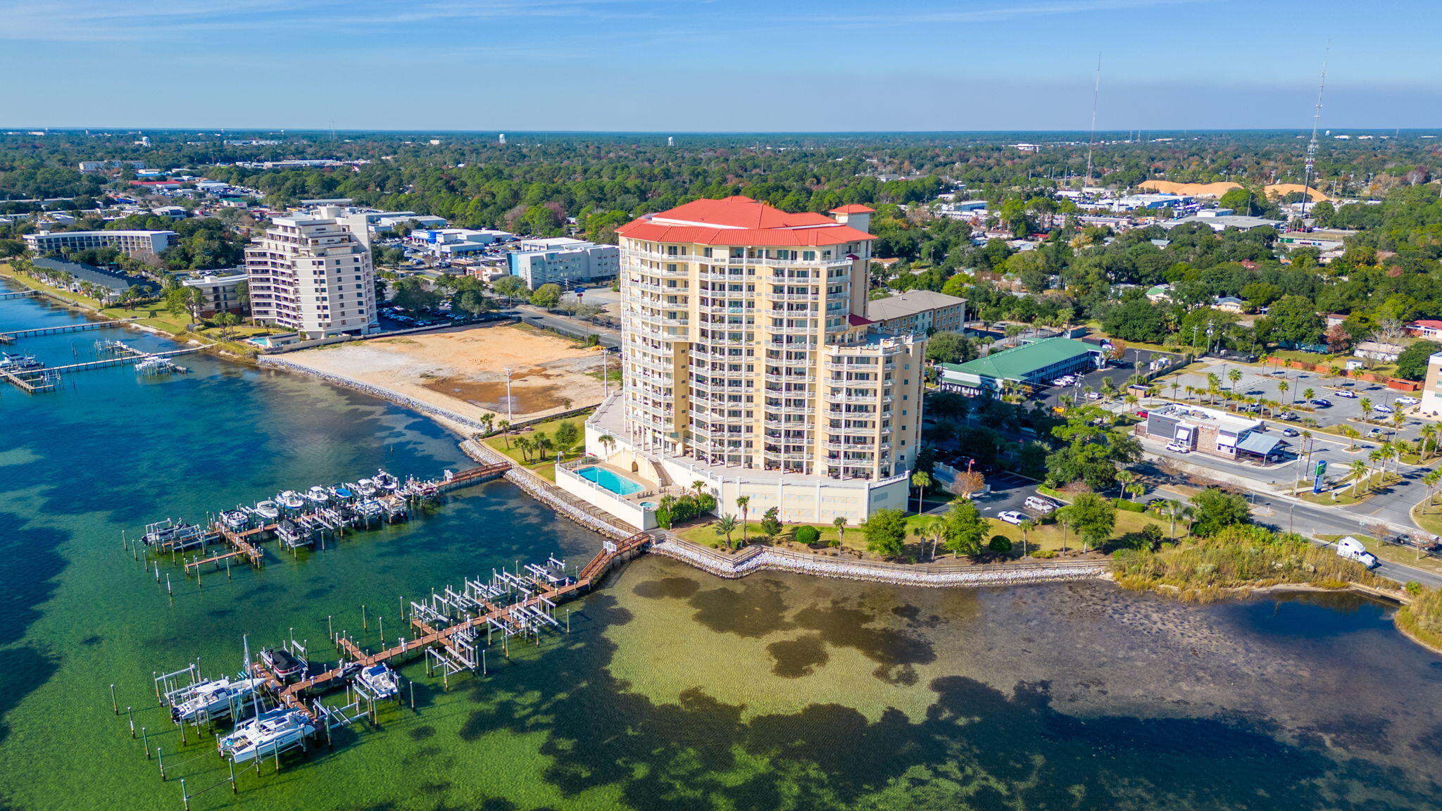 BOAT SLIP INCLUDED WITH NEW LIFT! Experience luxury living in this spectacular waterfront condo in the sought after Persidio Yacht Club in Fort Walton Beach! The complex offers high end amenities including a large pool and hot tub, media room, and large gym overlooking the water. What makes this unit special is that it comes equipped with two deeded parking spaces that are located in an enclosed garage as well as a deeded boat slip with a lift that is already included!If you are looking for an amazing primary or secondary residence to call home, then this is a must see! Persidio Yacht Club offers a luxury escape while being very close to all the amenities Fort Walton Beach has to offer. This unit is being sold fully furnished.