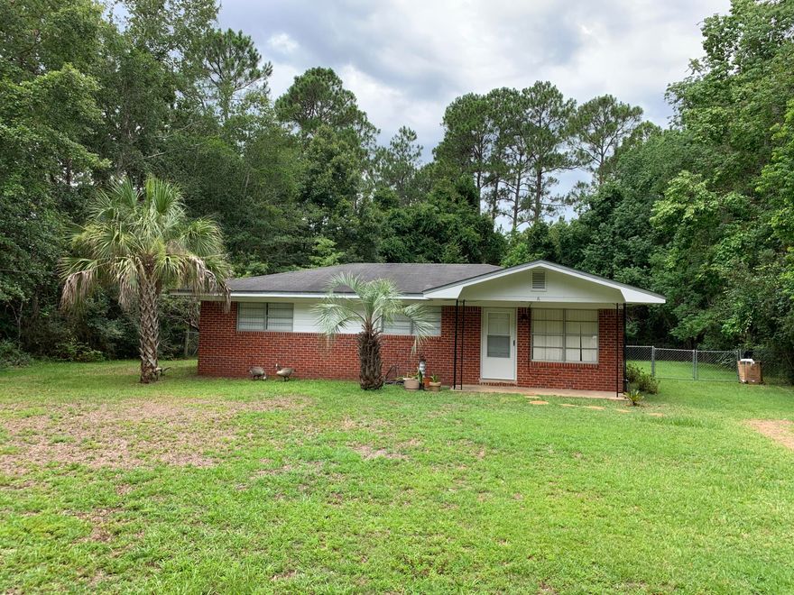 If you work in Pensacola or Milton and LOVE privacy, this absolutely adorable all brick ranch is in the PERFECT location on a private street just MINUTES from the Interstate. Easy access to Interstate 10, then 15 miles to Pensacola or 15 to Milton; Interior amenities include: Ceiling fans in the living room and all bedrooms. Inside laundry room with mop sink; light and bright kitchen with a window overlooking the backyard. New paint and almost new Carpet in Living Room, and one bedroom. Laminate Wood Flooring in two bedrooms. Exterior amenities include an OVER SIZED 1/3 ACRE LOT, with plenty of room in backyard! An outdoor shed stays with home. Surrounded by woods with a fenced yard. Check out the photos, and then make your appointment to see this great home!