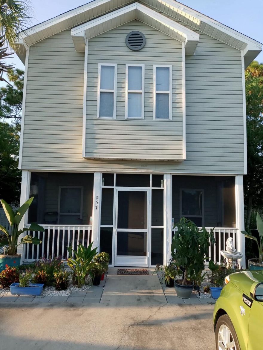 This detached home is a quiet end unit, bordering a nature preserve. Conveniently located near bustling Grand Boulevard, Sacred Heart hospital and Silver Sands Outlets. The beaches of 30A are only three miles away. Enchanted Estates has a community pool, and all landscaping/shrubs are maintained by the HOA. Several recent updates include a new silicone coated metal roof meticulously installed with peel-and-seal technology and rust-free coating in April 2023, which ensures durability and peace of mind for years to come. A new hot water heater was thoughtfully installed in 2022, providing efficiency and reliability. A new screened-in front porch enhances functionality and relaxation. Inside, abundant natural light fills the open living, dining, and kitchen areas. A first-floor primary bedroom has a spacious walk-in closet and is accompanied by an en-suite bath with a double vanity, tub, and shower combination. Additional storage resides under the stairs, conveniently adjacent to the half-bath,The second floor reveals two generously size bedrooms, each with its own walk-in closet. A shared bathroom completes this level. Don't miss the opportunity to make this your own retreat amidst the vibrant heartbeat of Miramar and Santa Rosa Beach! ***Buyer is responsible for personally verifying details about this property. Any information contained in this listing is believed to be accurate but is not guaranteed.***