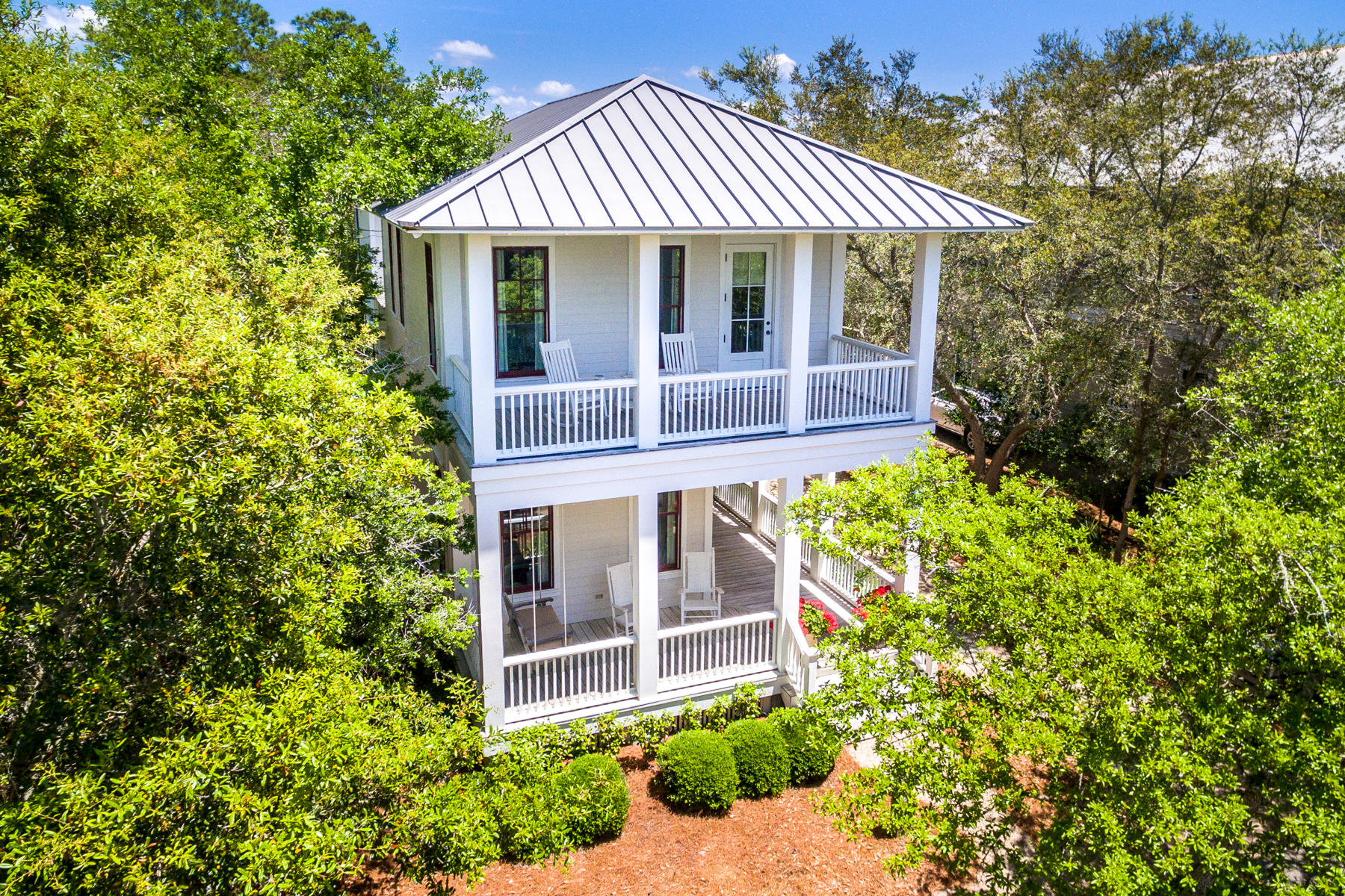 Classic elegance and warmth in this lakeside home on Western Lake in Phase I of Watercolor. One of the best lake views in Watercolor - only four houses from the community pool and less than a 5 minute walk to the beach, Camp Watercolor, the Frog Pool, tennis courts, and Seaside shops, and restaurants. The heart of this home is the big open area, where kitchen, dining room, and living room - and even the downstairs front and back porches - all connect, allowing for hours of gathering with friends and family. The ceiling in the great room is white washed cypress. Other special features of this home include a built-in bunk room for six, as well as four big, beautiful porches, including two screened porches. Home is being sold furnished with some exclusions. The 4th bedroom is a bunk room.