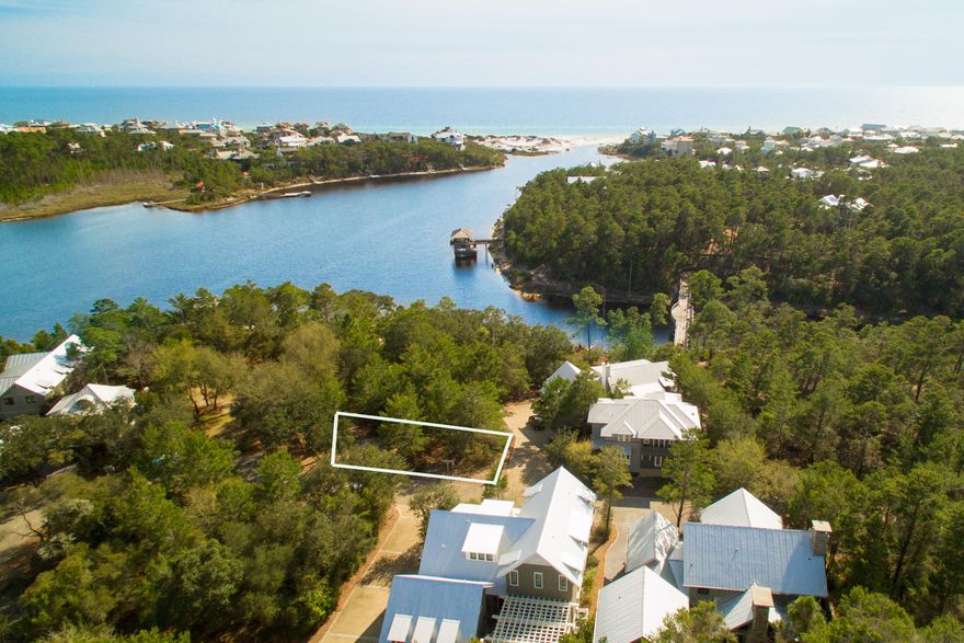 This lot, located 3 lots back from the lake, fronts a community park and will have beautiful views of both Draper Lake and the Gulf of Mexico.This is a Type II Park lot which has the distinct advantage of allowing a building height of forty (40) feet for the home versus a limit of thirty (30) feet for the lake or street type lots! Owners have easy access to two swimming pools, two boathouses, an observation tower, parks, and the bridges which connect the peninsulas.The community of Draper Lake was designed to protect the unique flora, fauna, and marine life surrounding this rare coastal dune lake. This 28-acres development, designed by Duany, Elazabeth Plater-Zybeck and Dover Kohl, offers residents walking paths and nature trails throughout.