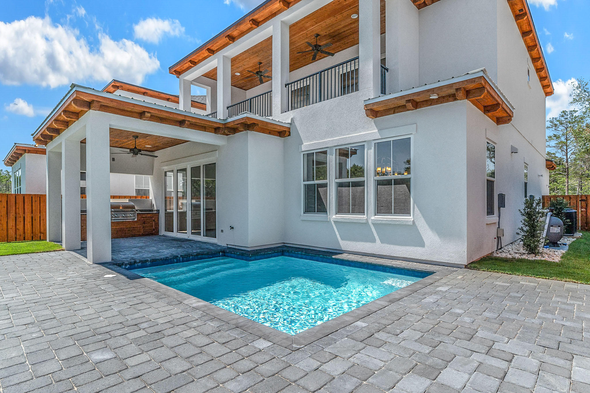 This Beautiful New 4 bedroom house has tons of upgrades. 1 car garage, hardwood and tile floors, custom tile shower, standing soaker tubs, Ship lap on walls, 66 in Fridge/freezer, stainless steel appliances , gas, Navien tankless water heater. 2 living rooms 2 AC units and fabulous balcony. Private pool and outdoor kitchen area. This 10 home subdivision is just minutes away from the beach and Gulf Place Center, restaurants, shops and golf.
