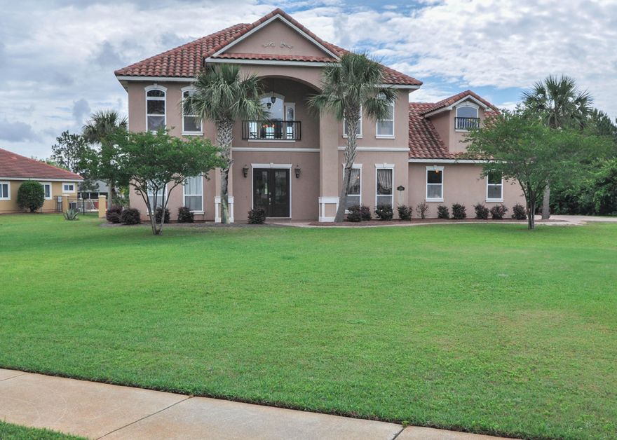 WOW This is a MUST SEE 5 bedroom waterfront, 3.5 bath Trieste home located on Lake Piazza! LOWEST PRICE sq. ft. in community. Home has fabulous 20 foot ceiling in living area with a wall of windows overlooking the lake, and a unique walk-over bridge between upstairs bedrooms. Large master suite is located on the first floor, and has double vanity, separate shower and garden tub, spacious walk-in closet, and French doors leading to covered rear porch, so you can sit and enjoy your morning coffee looking out on the lake. Four very large bedrooms are located upstairs, along with a 13X22 foot PLAY ROOM that could make a 6th bedroom! Home sits on a prime corner lot located only one block from the GATED entrance to the New Trieste neighborhood. This home is one of a kind built by a local builder