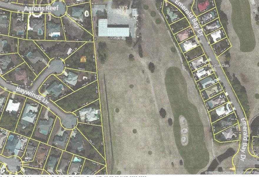 Beautiful half acre lot in Emerald Bay. Emerald Bay is a gated community with golf course, clubhouse, pool, tennis and community guest house. This homesite is located in Flood Zone X(no flood insurance required). Dimensions to be verified by buyer.