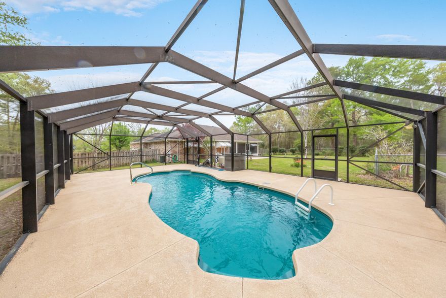 Come see this very nice 3 bedroom 2 bath home with pool and enclosure. This home features a spacious living room with eat in kitchen opens up to an breakfast nook and the living room.  There is a separate dinning room and office off the entry way.  They lot is a full acre and high and dry. With no HOA.