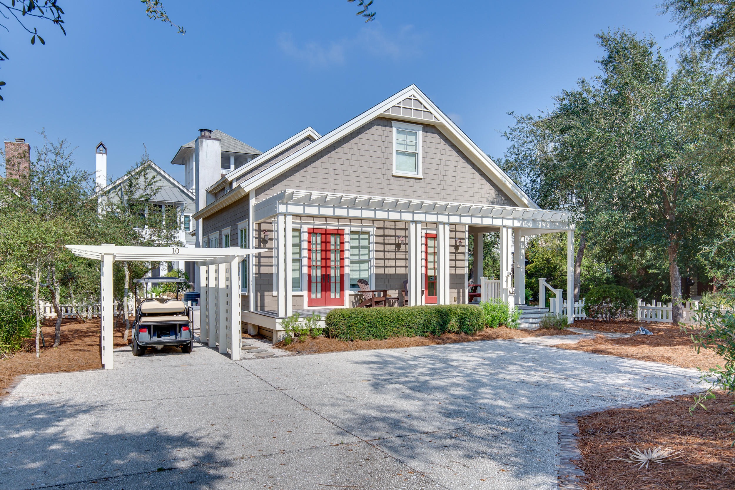 JUST REDUCED by $150K!! A quintessential Florida Cottage, inside the gated community of Watersound Beach, on a premium corner lot with plenty of space to add a Carriage house and pool. The 2 large wraparound porches and a short distance to the most desirable beaches offers the perfect beach lifestyle. Large back porch overlooks a community boardwalk that takes you to the white sandy beaches of the Gulf of Mexico. The open floorplan offers 10' ceilings downstairs, 9' ceilings upstairs, with recessed lighting, hardwood floors, crown molding, exquisite millwork with 6' baseboards and custom shades/curtains throughout. The gourmet kitchen features newer KitchenAid appliances installed in 2018, granite countertops, upgraded cabinets, an oversized island and under cabinet lighting.