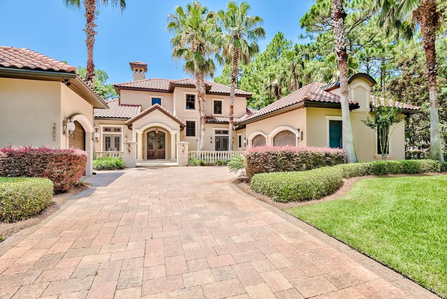 Phenomenal custom built home in the exclusive community of Burnt Pine on an expansive lot totaling over 1/3 acre. This property offers privacy and serene views of the golf course and pond. Home is perfectly situated on the 6th fairway of the Burnt Pine Club golf course and offers plentiful outdoor spaces including a screened-in lanai, salt water pool, hot tub, incredible summer kitchen, patio and wraparound balcony. There is fantastic curb appeal with beautiful landscaping, paver stone driveway and custom exterior lighting. The interior features exquisite finishes and architectural details throughout. Tiered tray ceilings, glass blown chandeliers, intricate mosaic tile work, beautiful travertine and hardwood flooring and custom built-in shelving and cabinetry set this home above the rest!