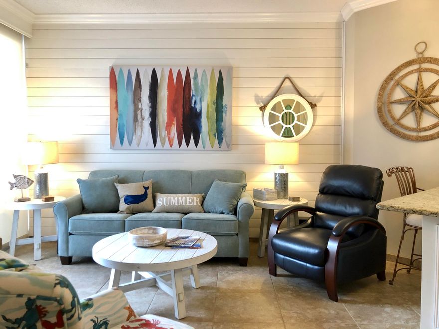 Upscale 1BR/1BA unit in Surfside just across the sugary white sand and emerald waters of the gulf coast. Conveniently located on the ground floor with a walk out patio - easily stroll to the beach without an elevator! Spacious unit with 10ft ceilings in the living room and bedroom! Private patio to enjoy your morning coffee. Unit sleeps four people comfortably. 20' tile in kitchen and bath, new LVP in the bedroom! Granite countertops in the kitchen with breakfast bar and new stainless steel side-by-side refrigerator. Oversized walk-in tile shower in the bathroom. Surfside amenities include on site restaurant Royal Palm Grill, large heated pool, kiddie pool, 2 hot tubs, poolside Tiki bar, sauna, sky bridge connecting the pool to the private Surfside beach,