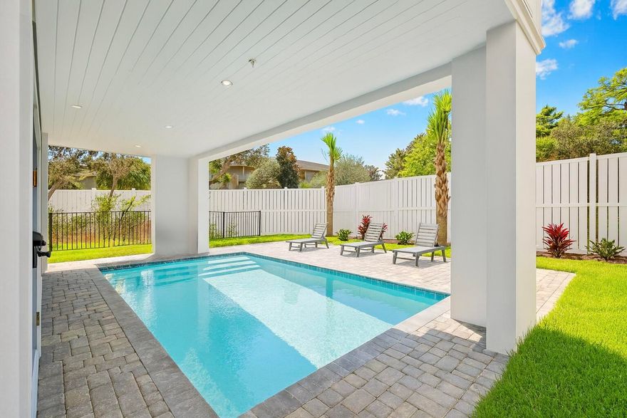 Brand-new and just finished, this four-story beach retreat sits south of Scenic Highway 30A on Mary Street, less than a 5-minute walk to the white sand beaches and emerald green waters of Blue Mountain Beach, Fla. Designed as a true rental powerhouse with projections around $235,000, this 5BR/5BA+2 half bath home is built for fun, comfort, and income. The first level lives like a poolside cabana, with a mini kitchen, half bath, and a full wall of sliders that open straight out to the private pool and sun deck--perfect for entertaining. Upstairs, the main living floor offers a large open kitchen, dining, and living area with Thermador appliances, a gas range, a sweeping island, and a walk-in pantry, ideal for big groups to gather. The whole second floor is dedicated to this open