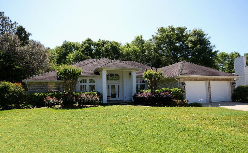 Rocky Bayou home with a backyard oasis including a beautiful pool with screen enclosure and pavered patio. Inside you'll find 2 living rooms, a fireplace, dining room and more! The kitchen is equipped with stainless steel appliances, granite countertops, and plenty of cabinet space. The property boasts a spacious half-acre lot with a level terrain and wooded areas that provide privacy and tranquility. This property is perfect for those who love to entertain with its open floor plan, large outdoor patio, and fire pit. You'll also benefit from the Generac whole-home generator.
