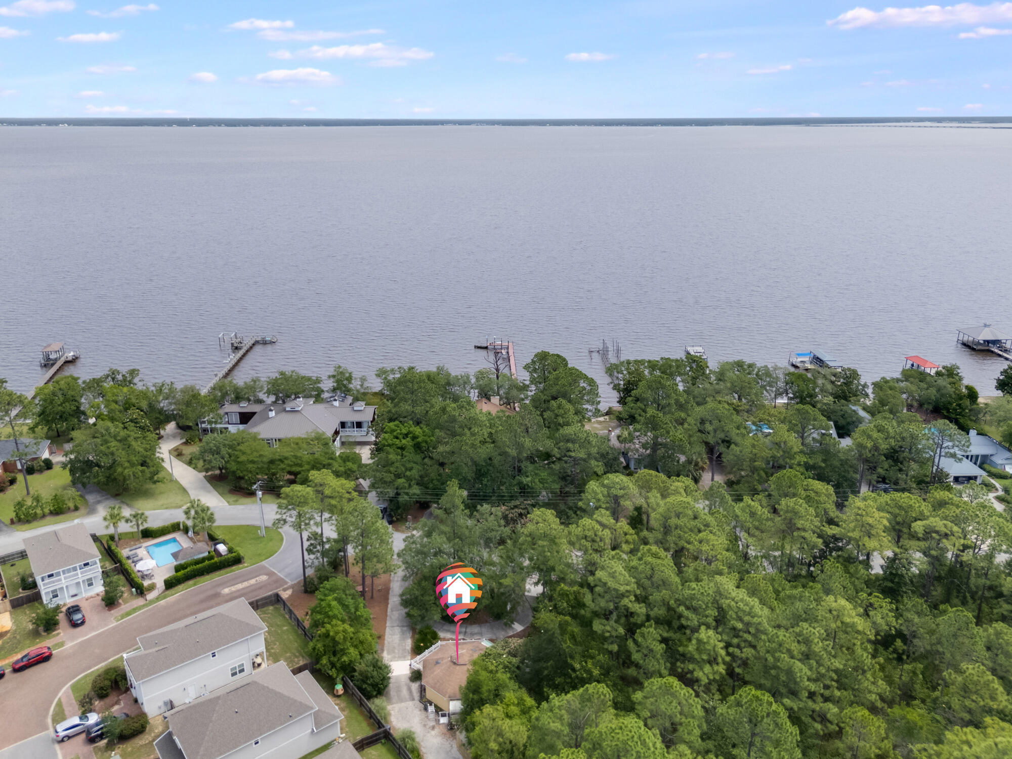 Amazing opportunity to build your dream home by the Bay, or opportunity to renovate a 1 bedroom Bay cottage! Over 1/3 of an acre across the street from the Bay, this property can either be torn down or renovated. Kellogg Park is just 0.4 miles down the street, and with 2 greenhouses and an open garage, this is a great opportunity to own close to the Bay.