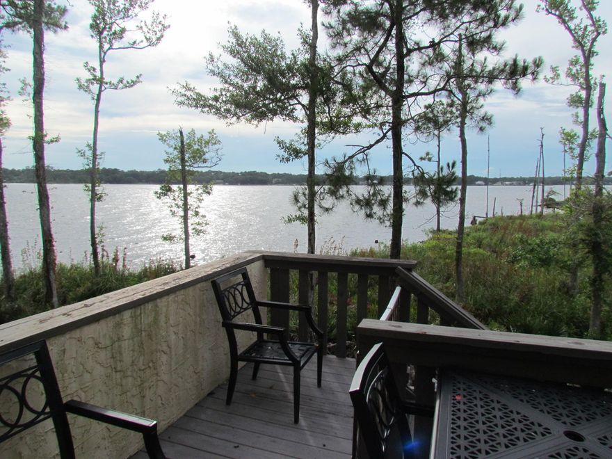 Enjoy this fully furnished, 3 bedroom, 2 and a half bath updated townhome. All you need is your suitcase and then sit on the deck and enjoy the best view around! Walk to the marina and dine at Schooners. 18 inch tile flooring so easy clean up. Spacious livingroom, dining room and sitting area looking over the bay. Master has waterfront view! Garage with auto garage door opener. Association takes care of yard maintenance. Owner will consider short term leases 3+ months. Call today for your showing appointment. $2500/month. Sorry no pets and not smoking allowed.