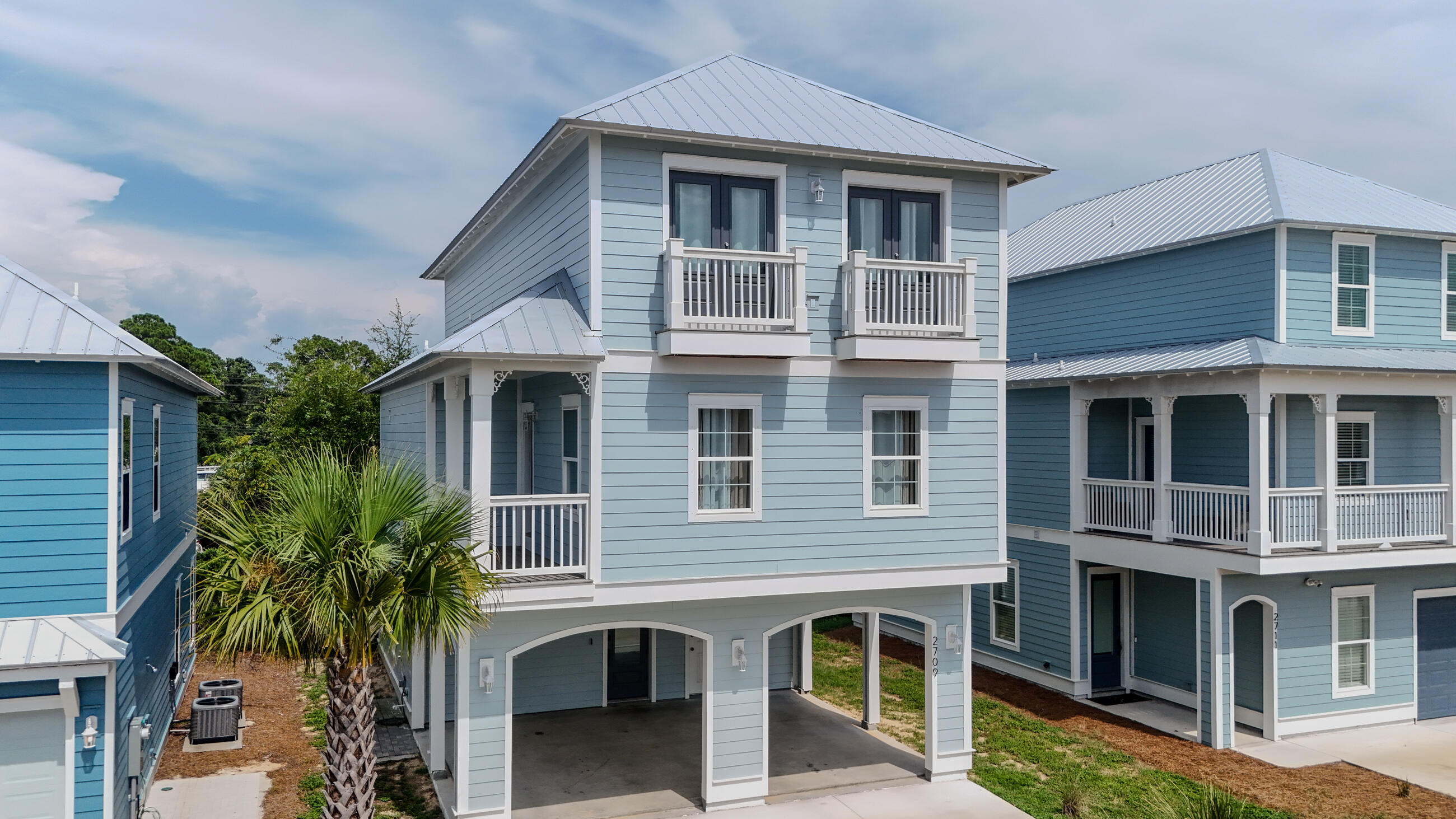 LIKE NEW-2023, IMMACULATE, 3 Story, 4BR/3.1BA New Orleans Style Home in one of PCB's NEWEST subdivisions, Lagoon Manor, with only 12 homes in subdivision. This lovely 3 story home is sold fully furnished & tastefully decorated with high end furnishings and decor to compliment every room. Lots of privacy for everyone. Custom white cabinets, granite countertops, subway backsplash, stainless appliances, gas range. First floor master suite. Oversized media room for extra entertainment. Lots of balconies on this one! Rental ready with great short term rental potential or an upscale beach getaway just minutes from World's Most Beautiful White Sandy Beaches and Emerald Coastline. Subdivision is next to Signal Hills Golf Course. Just minutes from entertainment, shopping and fun!