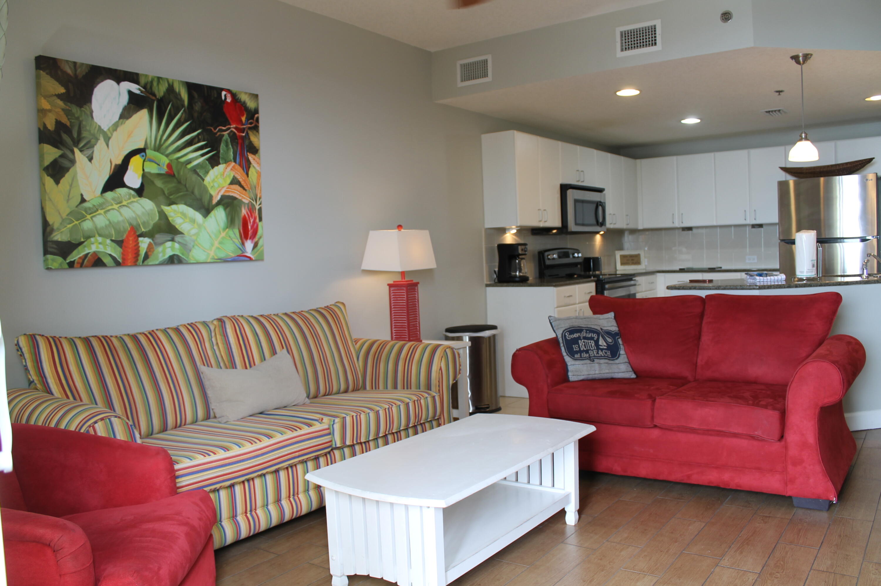 This gorgeous Grand Panama Beach Resort condo is a much sought after one bedroom, two bathroom with a bunk area, offering comfortable accommodations for up to six guests. This beautiful unit features a queen bed in the master bedroom, a twin-over-twin bunk bed in the hallway alcove, and a queen sleeper sofa in the living area. The fully equipped kitchen boasts granite countertops, stainless appliances and a breakfast bar, while the open-concept living and dining area provides a welcoming space to relax. The private balcony offers stunning views of the Gulf of America.Resort amenities include two heated swimming pools, hot tubs, a fitness center, a tiki bar, a kiddie pool, covered parking, 24/7 security, and an on-site general store to purchase those last minute vacation items