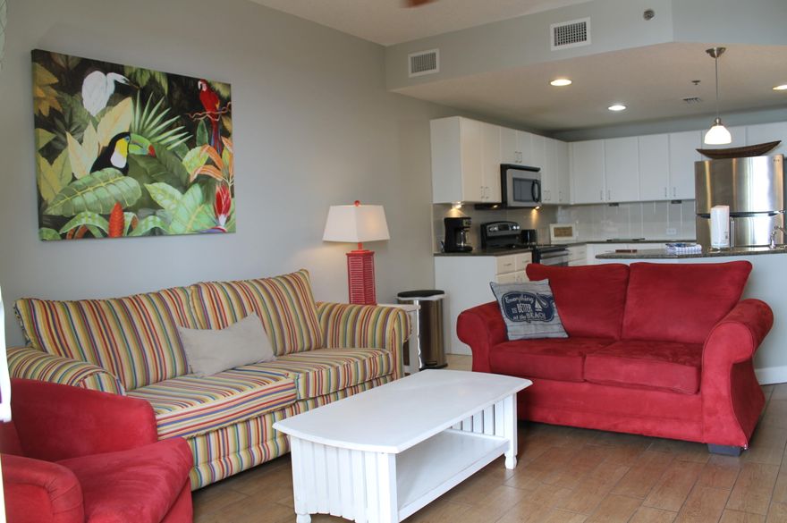 This gorgeous Grand Panama Beach Resort condo is a much sought after one bedroom, two bathroom with a bunk area, offering comfortable accommodations for up to six guests. This beautiful unit features a queen bed in the master bedroom, a twin-over-twin bunk bed in the hallway alcove, and a queen sleeper sofa in the living area. The fully equipped kitchen boasts granite countertops, stainless appliances and a breakfast bar, while the open-concept living and dining area provides a welcoming space to relax. The private balcony offers stunning views of the Gulf of America.Resort amenities include two heated swimming pools, hot tubs, a fitness center, a tiki bar, a kiddie pool, covered parking, 24/7 security, and an on-site general store to purchase those last minute vacation items