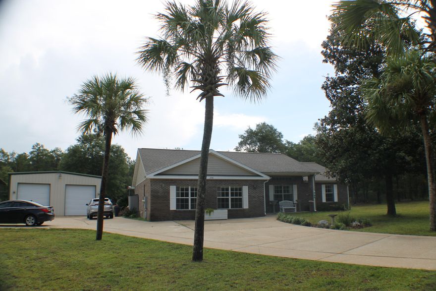 Beautiful All brick home with lots of room Outside! This all brick three bedroom two bath home is in the perfect location for an easy commute to Area Beaches, Bases near the intersection at Mossy Head i-10,Hwy 90 and 285 South! New industry at the intersection Fed-x, fuel,hotel, Truck sales and service ! this location is on the Move! Beautiful landscaped yard, $1,000 of dollars in concrete work,a beautiful two door shop with 110, and 220 power! Rv Shed and a separate meter for an rv,mobile home or another house! Load your hotrod for and your RV to bring them home to 208 Hinote Road today!