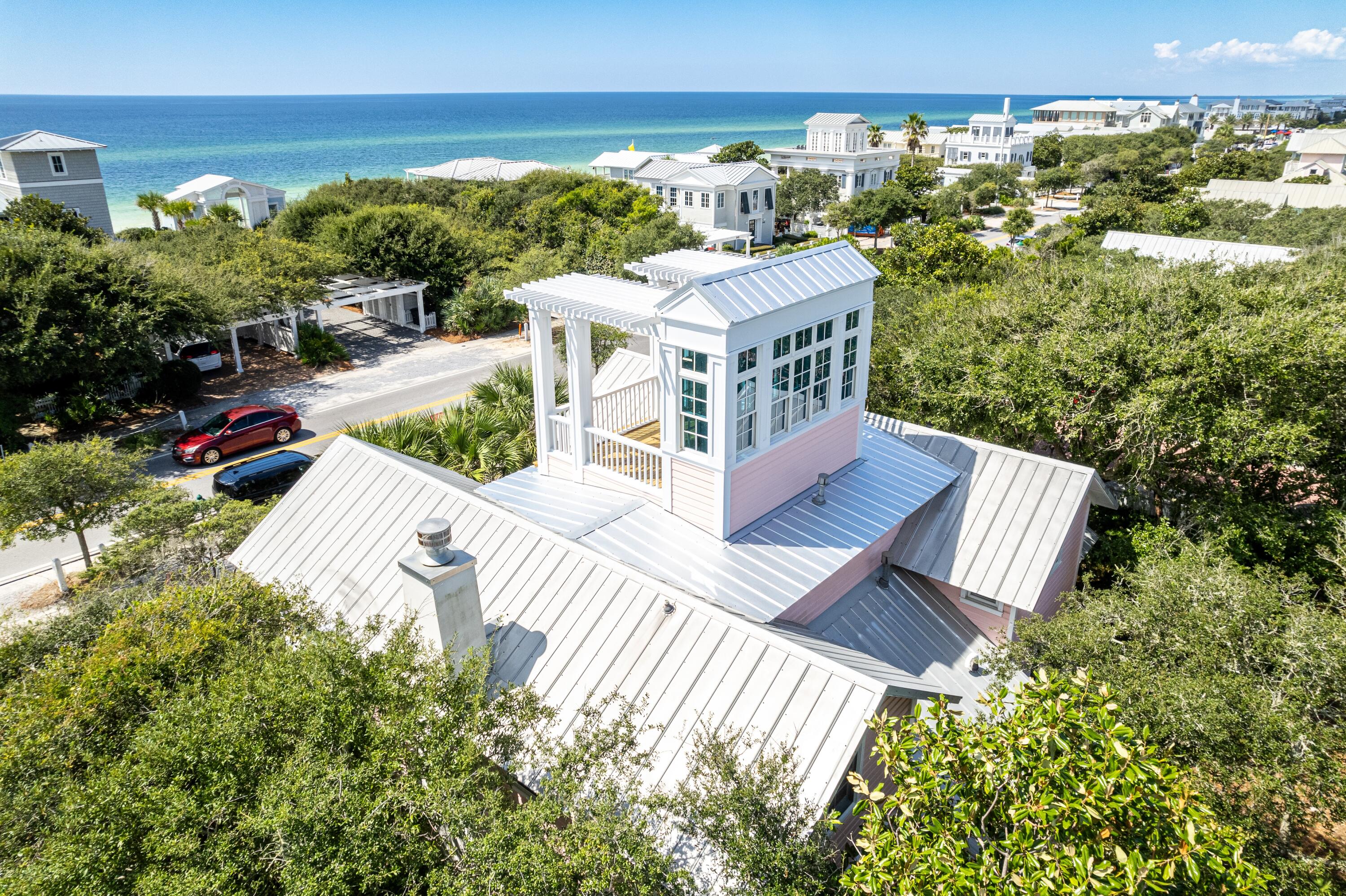 One doesn't have to travel to New York City to experience the 'Upper East Side.' This lovelyversion is nestled directly across from the iconic Tupelo Street beach-access pavilion, and the Gulfviews are stunning! Location, location, location may sound cliche, but it's undeniably true with thelocation of Upper East Side. This prime spot on 30A is mere steps from the beach, and willfast become your favorite beach getaway.Upon entering, you are greeted by a lovely sunlit room featuring a beautiful kitchen, dining area, bonus room with a trundle bed, full bathroom, and a convenient laundry room. Proceeding down the hallway, you will discover a gorgeous living room with a fireplace, wet bar, and sunroom. Two separate doors lead to either the front or back porches, allowing for easy access to outdoor spaces.
The stairs off the kitchen area take you to the second floor where you will find a spacious master
suite with en-suite bathroom, and a delightful sunroom/sitting room. A guest bedroom with its
en-suite bathroom is separated from the master by a sundeck. Venture further up to the tower for panoramic, never-ending views of the Gulf and unforgettable sunsets! This is the true meaning of "location."
Additionally, a storage shed behind the home contains Kevlar storm shutters for added peace of mind.