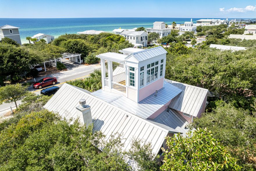 One doesn't have to travel to New York City to experience the 'Upper East Side.' This lovelyversion is nestled directly across from the iconic Tupelo Street beach-access pavilion, and the Gulfviews are stunning! Location, location, location may sound cliche, but it's undeniably true with thelocation of Upper East Side. This prime spot on 30A is mere steps from the beach, and willfast become your favorite beach getaway.Upon entering, you are greeted by a lovely sunlit room featuring a beautiful kitchen, dining area, bonus room with a trundle bed, full bathroom, and a convenient laundry room. Proceeding down the hallway, you will discover a gorgeous living room with a fireplace, wet bar, and sunroom. Two separate doors lead to either the front or back porches, allowing for easy access to outdoor spaces.
The stairs off the kitchen area take you to the second floor where you will find a spacious master
suite with en-suite bathroom, and a delightful sunroom/sitting room. A guest bedroom with its
en-suite bathroom is separated from the master by a sundeck. Venture further up to the tower for panoramic, never-ending views of the Gulf and unforgettable sunsets! This is the true meaning of "location."

Additionally, a storage shed behind the home contains Kevlar storm shutters for added peace of mind.

