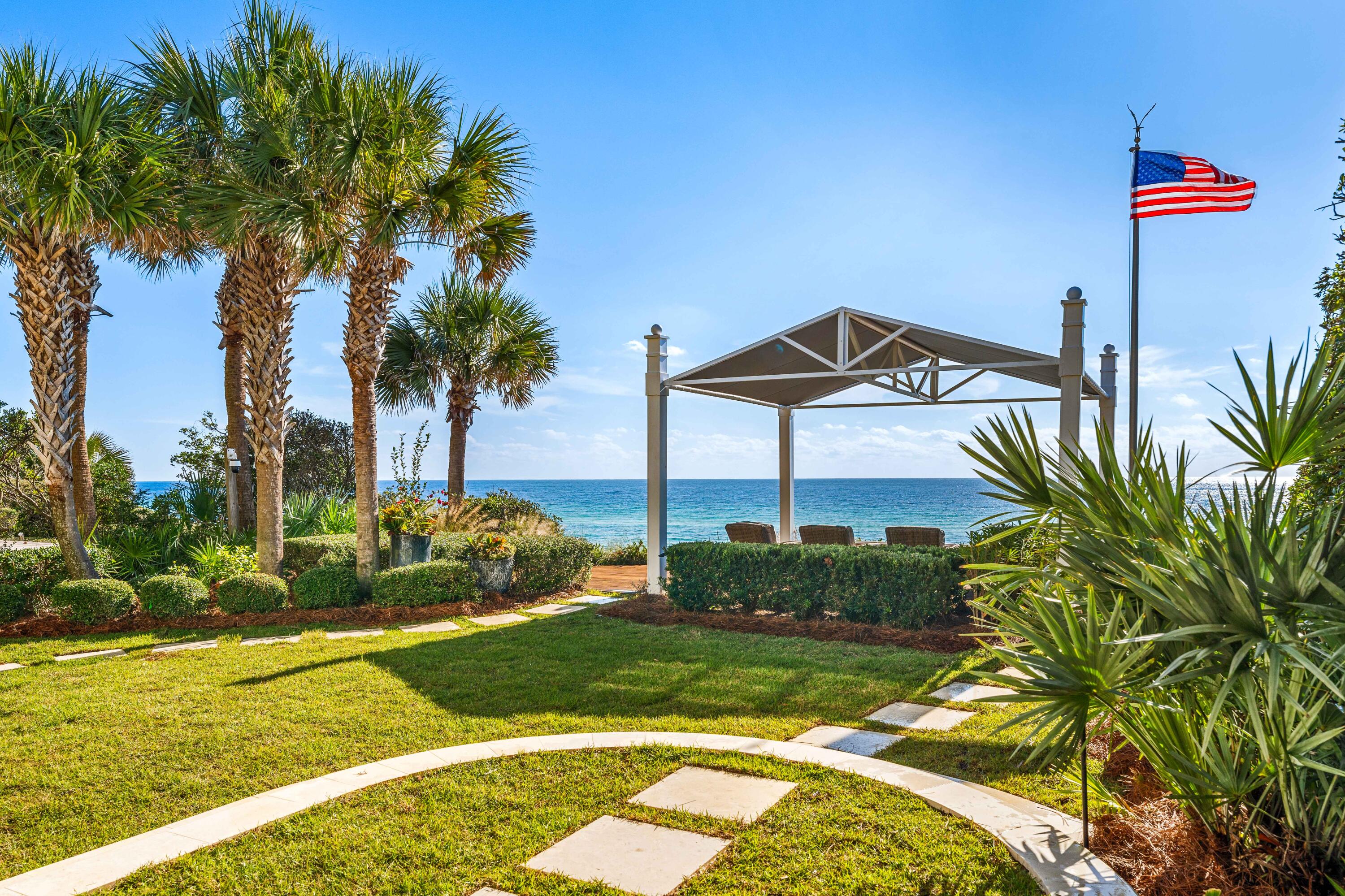 Sheltered by Old Seagrove's characteristic oak canopy, this impeccable gulf front property presents an opportunity to own an authentic piece of 30A with 60' of gulf frontage resting on a 32' bluff overlooking a stunning stretch of the Gulf of Mexico. Designed by Thurber Architects, this 4BR/4.5BA retreat offers nearly 4,300 square feet of meticulously and uniquely designed living spaces that feature all the luxuries of home plus so much more! Notable features include a private boardwalk to the beach, loggia with heated swimming pool and gulf facing glass nano wall, landscaped gulf front lawn with a canopied pavilion, elevator, state-of-the-art home technology system, dual master suites, and a two-car garage. Step inside the foyer to reveal a floating European white oak staircase highlighted by a one-of-kind Turkish chandelier. The first-floor living space seamlessly blends luxury and convenience, featuring a wall of floor-to-ceiling windows, a gas fireplace, and direct access to a newly tiled private loggia with a heated spa pool with fountains and an outdoor gas fireplace. The nano glass door system effortlessly retracts to reveal a stunning gulf-front garden, complete with landscape lighting and lush tropical vistas. The gourmet kitchen is a culinary dream, expertly designed with top-tier appliances, including double Bosch dishwashers, dual ovens, a Wolf warming drawer, a Subzero refrigerator, a full-size wine cooler, a 36" Wolf range, a Miele induction cooktop, and an icemaker. A first level master suite offers gulf views, his and hers closets, and an elegant ensuite bathroom with radiant heated marble floors, toe heaters, and a walk-in shower.
Upstairs discover two comfortable guest rooms with ensuite bathrooms, one currently configured as a media room/office space. The expansive gulf front, second-level master suite features a morning bar with second laundry area, a private covered balcony overlooking the gulf, and a spacious California closet with custom cabinetry. The luxe ensuite offers dual vanities, Italian heated marble floors, toe heaters, marble countertops, a walk-in shower, and a private water closet with bidet.
The state-of-the-art home technology system provides seamless control over lighting, sound, and security through advanced Lutron and Control 4 systems. Additional features include 12' ceilings, Dornbracht plumbing fixtures, custom drapes with blackout lining, electronic shades, tankless water heaters, concrete construction, a sea wall, and much more. Nestled in a coveted location in Old Seagrove only moments from Seaside, this gulf front residence offers a rare combination of luxury, function, convenience, and character. 