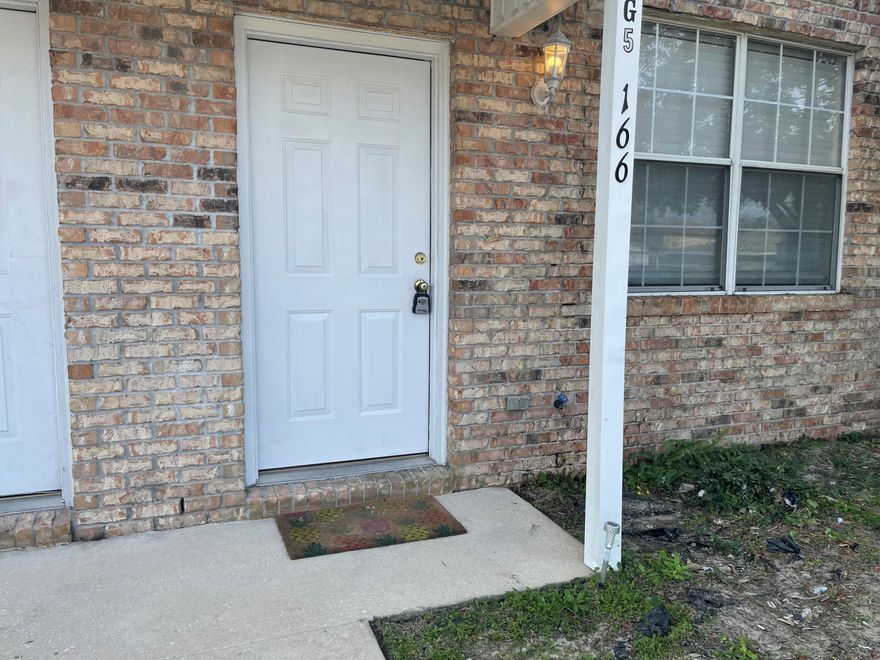 Well maintained townhome close to schools, shopping and beaches.2 bedroom townhome with New paint and carpet. Kitchen features include tile flooring, large walk in panty, breakfast bar and a dining area.  Large covered back porch with an attached utility room, washer dryer hook ups inside. Community pool just steps away.