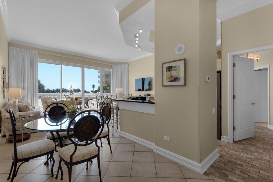 Wow!  This lobby level 3-bedroom, 3 bath condo has 11-foot ceilings making it feel extremely open and spacious. The renovated kitchen boasts granite countertops with breakfast bar, white cabinets, unique back splash and stainless-steel appliances. A wall of windows provides a beautiful view. Sliding glass doors lead to the lanai terrace, lagoon pool and beach. All the bedrooms have lovely brick tile flooring. The master bedroom with terrace access has a walk-in closet and enjoy a jacuzzi tub and separate walk-in shower in the master bathroom.  The 2 guest bedrooms are large enough to accommodate a king bed or 2 queen beds in each and share a second small terrace.  This lovely condo is sold completely furnished and move-in or rental ready. .  The Silver Shells Resort sits on 27+ acres with