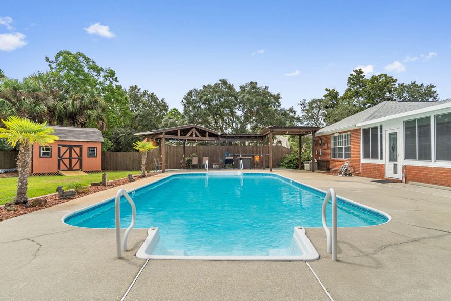 Welcome home to your own piece of paradise where you'll enjoy the best of Florida living with an amazing backyard oasis in a neighborhood that has deeded water access to the Santa Rosa Sound! This gorgeous POOL home had a new roof installed in 2021 and will have fully paid off solar panels at closing for a massive utility savings! This stunning 3 bedroom, 2 bath all brick home features 2346sqft with a formal dining room, an additional office/flex room, PLUS a huge additional 370sqft Florida room (not included in the house square footage but complete with a wall unit for heating and cooling!). Located in the popular subdivision of Sound Retreat, enjoy underground utilities and lush landscaping with an extended driveway pad for plenty of parking space. Enter the front door and you'll be met