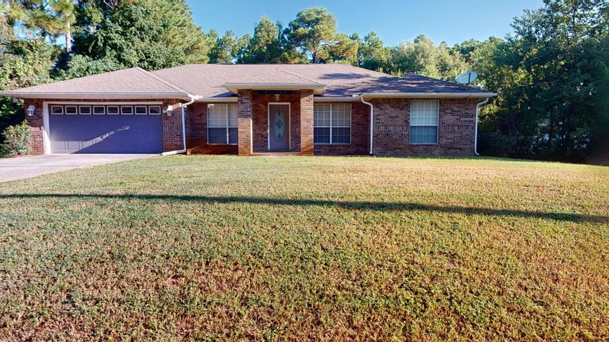 Come see your next home or investment property in Navarre that is a four bedroom 2 full bath home with a fireplace and vaulted ceilings.  The kitchen is a wonderful place for cooking and has numerous cabinetry for all your dining needs.  The kitchen has a breakfast bar that opens up to a wonderful breakfast nook and the home also has a dining room.  The Main Bedroom has a large  walk in closet with an amazing master bath that includes double vanities, a large garden tub and separate shower.  There is a large back yard that has plenty of room to add a pool  and a small patio that is accessible from the Main Bedroom and the Great Room.