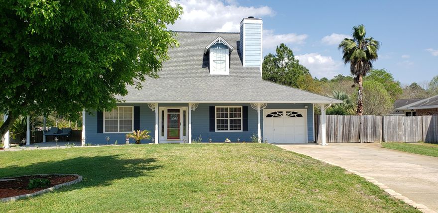 Beautiful Cape Cod style home in lovely Santander. 1750 Sqft (from an appraisal) and a very livable floor plan. Per the Property appraiser this home's effective age is 2006. 2 HVAC units to make 2 story living at the beach so comfortable. 2 master closets, plush carpet upstairs, all tile downstairs. A large eat-in kitchen with stainless back splash, granite surfaces, and solid wood cabinets. A new Septic system last year allowed for a new landscape retaining wall along the over-sized driveway. A beautiful fruit tree in the front yard offers plenty of shade for the wrap around porch - a great place to enjoy a beach breeze afternoon. A large backyard for BBQ's and side yard for boat storage. An gigantic mud room doubles as a playroom. Close to the beach!