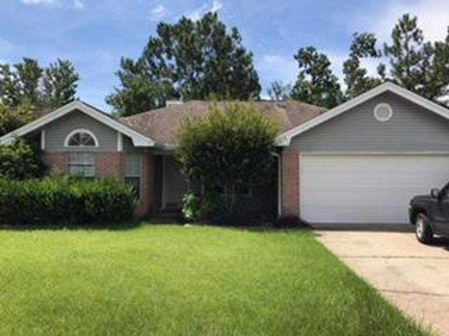 Large Living room area, with cathedral ceilings and a corner fireplace. Separate dining and kitchen both overlooking the lake. Spacious Master bedroom and walk in closet. This cute home located in Green Acres area, will go fast!