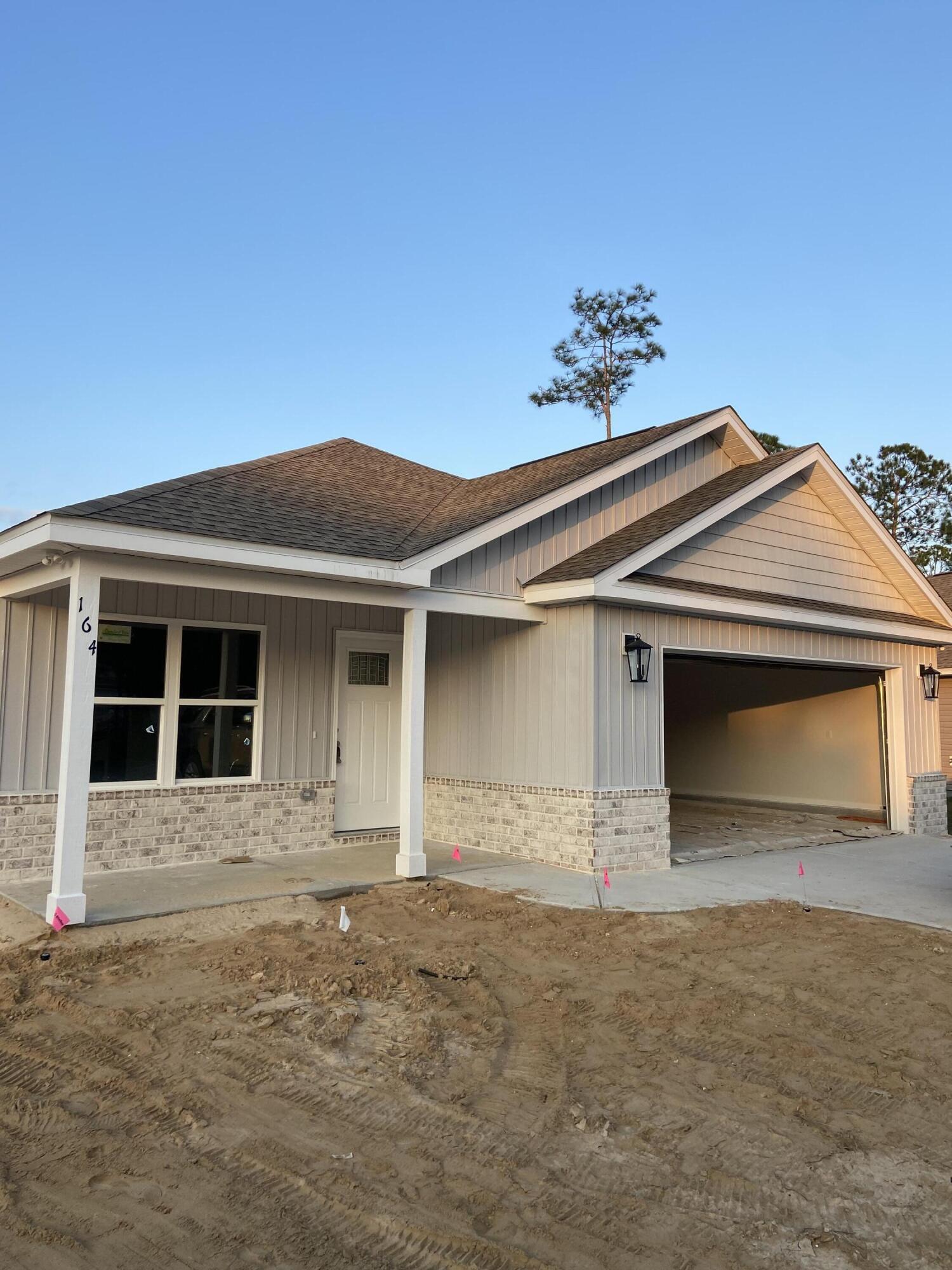 Estimated Time of Completion: January 2025Let this beautiful craftsman house become your home! It has a brick skirting under the vinyl siding that complements the cedar shakes above the 2-car garage. The inside features an open concept with cathedral ceilings and recessed lighting in the great room while opening into the kitchen. The kitchen has pretty shaker cabinets + a beautiful island with granite countertops. There is a separate walk-in pantry, laundry room, and mud bench area. The master bedroom sits to itself with its ensuite walk-in closet & full bathroom featuring a separate tub + shower. The other 3 bedrooms are on the opposite side of the house along with another full bathroom. You can also enjoy the outdoors from the front of back porch.