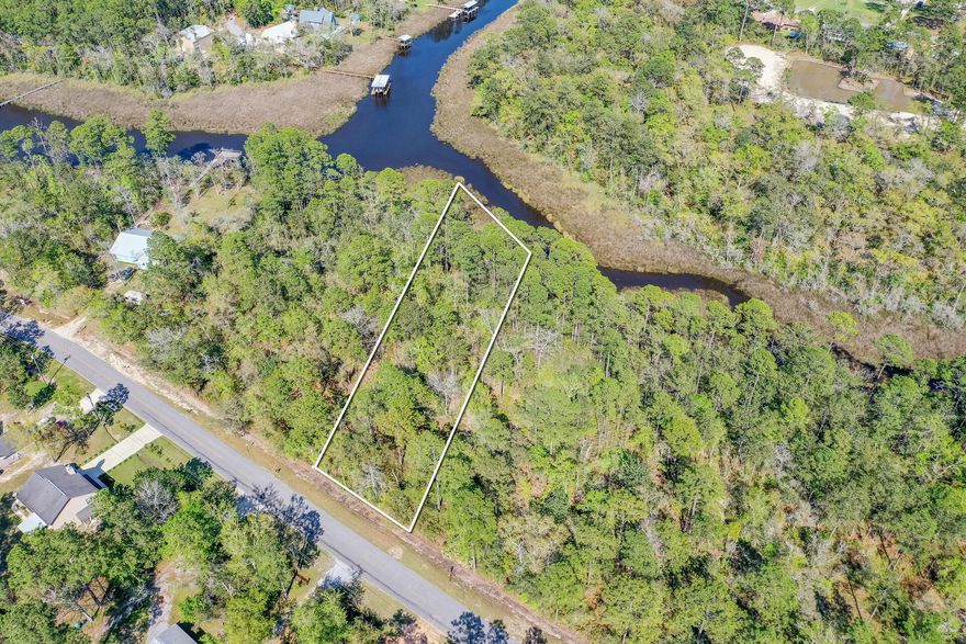 83 Feet on water on Mallet Bayou. Great location between Freeport proper and beaches along 30A. No survey, studies, all due diligence must be done by the buyer and recommended prior to making offer. Property sold as is.