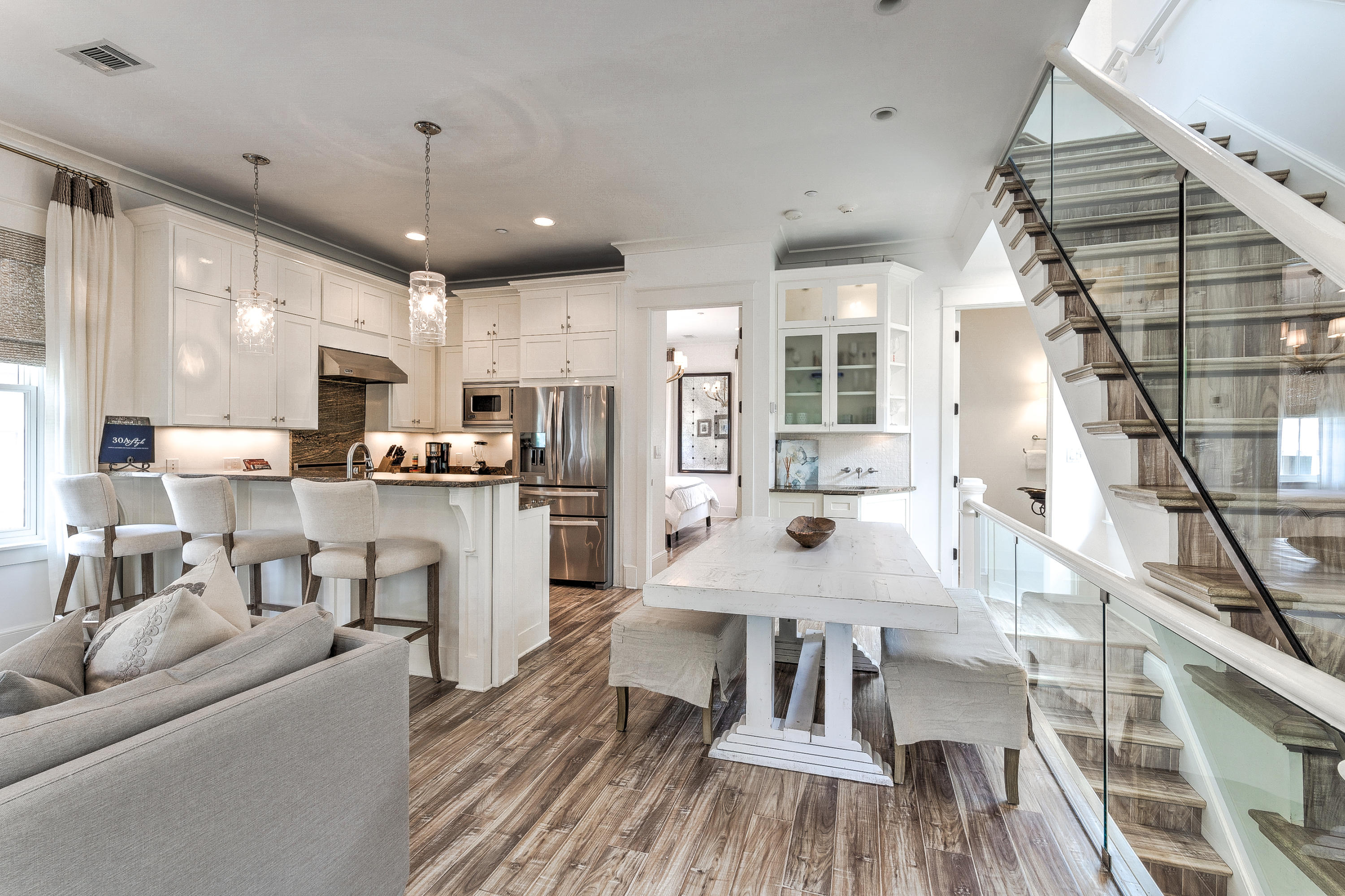 *SELLER IS ACCEPTING BACK-UP OFFERS.*Spectacular Rosemary Beach home with carriage house. This beautiful 3-story home was designed with all the style and charm of Rosemary Beach in mind.It's light, bright and decorated with coastal flair. As you enter the gate you will be greeted by a spacious, enclosed courtyard with plenty of seating for guests to enjoy their morning coffee or evening cocktail.The first floor of this home has a comfortable den with seating for 4 and a flat screen TV, a fabulous hangout for the kids.Off this den you have a bunk room with 2 full beds, sleeping 4, a flat screen TV and an attached bathroom with a large walk-in shower.Continue down the hall and you will find the first king bedroom with attached bathroom.