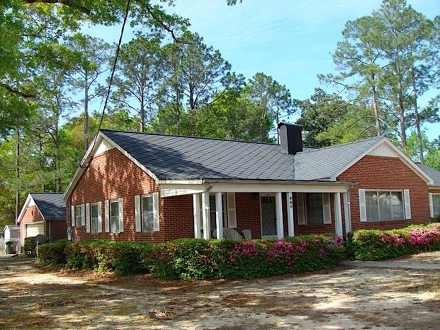 Don't miss this lovely brick rancher nestled in the heart of DeFuniak Springs, across the street from the Historic District and just three blocks from the Lakeyard and Chipley Park. While beautifully updated, this well-kept 3BR, 2BA house retains its historic charm -- solid oak flooring, refinished pine woodwork & doors, vintage tile baths, and spacious living areas. This home has been in the same family for 65 years, and was custom built by the Seller's father and mother. The house has been freshly painted throughout, and features a large eat-in kitchen with newer stainless steel appliances, including a convection oven. The dining room will hold a table for 10, the living room and master bedroom are huge, and there is a 2 car brick garage connected by an enclosed