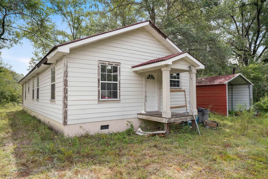 Estate Sale...Build Out...Investment Opportunity!! Located just minutes away from Black Creek and the Choctawhatchee River this 1400 sq. ft. 3  Bedroom/2 Bathroom property on over Three Tenths of an acre is a project in process due to the owner's passing. Hardi Plank Siding has been applied to the homes exterior and it has a metal roof. Excellent ''Build Out'' for permanent living or ''Investor Opportunity'', as the most recent sale of an updated finished out home in this general area sold for $124.17 per square foot. Conveniently located to Hwy. 3280 for quick travel access. Finish it out for your family or buy it to fix and flip for a sizeable profit. Included in the homes purchase is a carport with concrete pad, plumbing, flooring, and some electrical supplies. Come see it today!