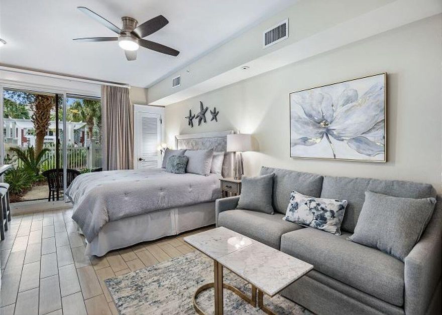 RARE LOCATION with private courtyard on the Amenity Terrace! Walk-out access to the Tropical Pool and Village of Baytowne Wharf!  A few minutes ride to the beach on the complimentary Tram.This updated, Coastal luxury studio offers walk out access to the tropical swimming pool, hot tub, fitness room and family BBQ area. The Village of Baytowne Wharf is literally a few steps away! Tram service to the beach is conveniently located just outside the building front door.This stylish studio comfortably sleeps four with a king bed, a queen sleeper sofa, and a HDTV. There is a full bathroom with a shower/bathtub combination. New wood flooring and furnishings enhance the coastal vibe. A fully stocked kitchenette offers a mini-refrigerator, toaster, microwave, coffee maker, dishes and flatware.