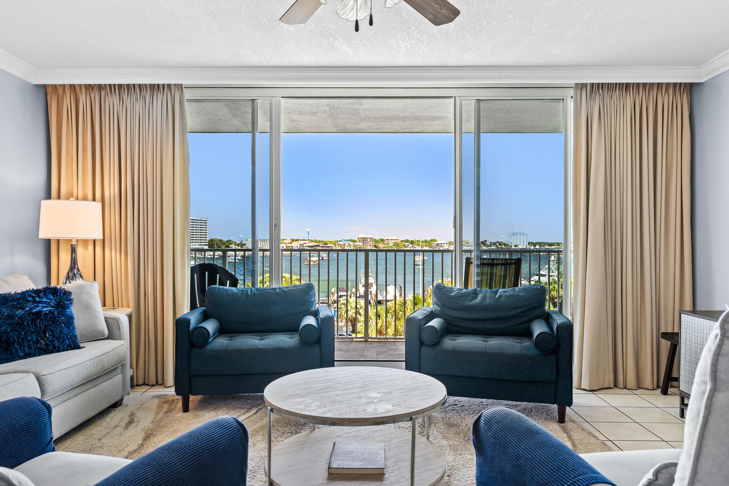Panoramic Harbor view from every room with an expansive balcony to sit and relax and watch all of the activities the Destin Harbor has to offer. The condo has new paint, new furniture, new carpet, new appliances and as an added Bonus, this condo comes with a 38' boat slip, #7.   The Kitchen features Corian countertops and stainless appliances. The Washer/Dryer is next door.  There is a Heated pool plus hot tub and a private beach to enjoy the views of the Destin Pass and Crab Island.  This condo is move in ready.  If you would like to see, please call the listing agent for availability.  All square footage, room dimensions, condo association information to be verified by Buyer.
