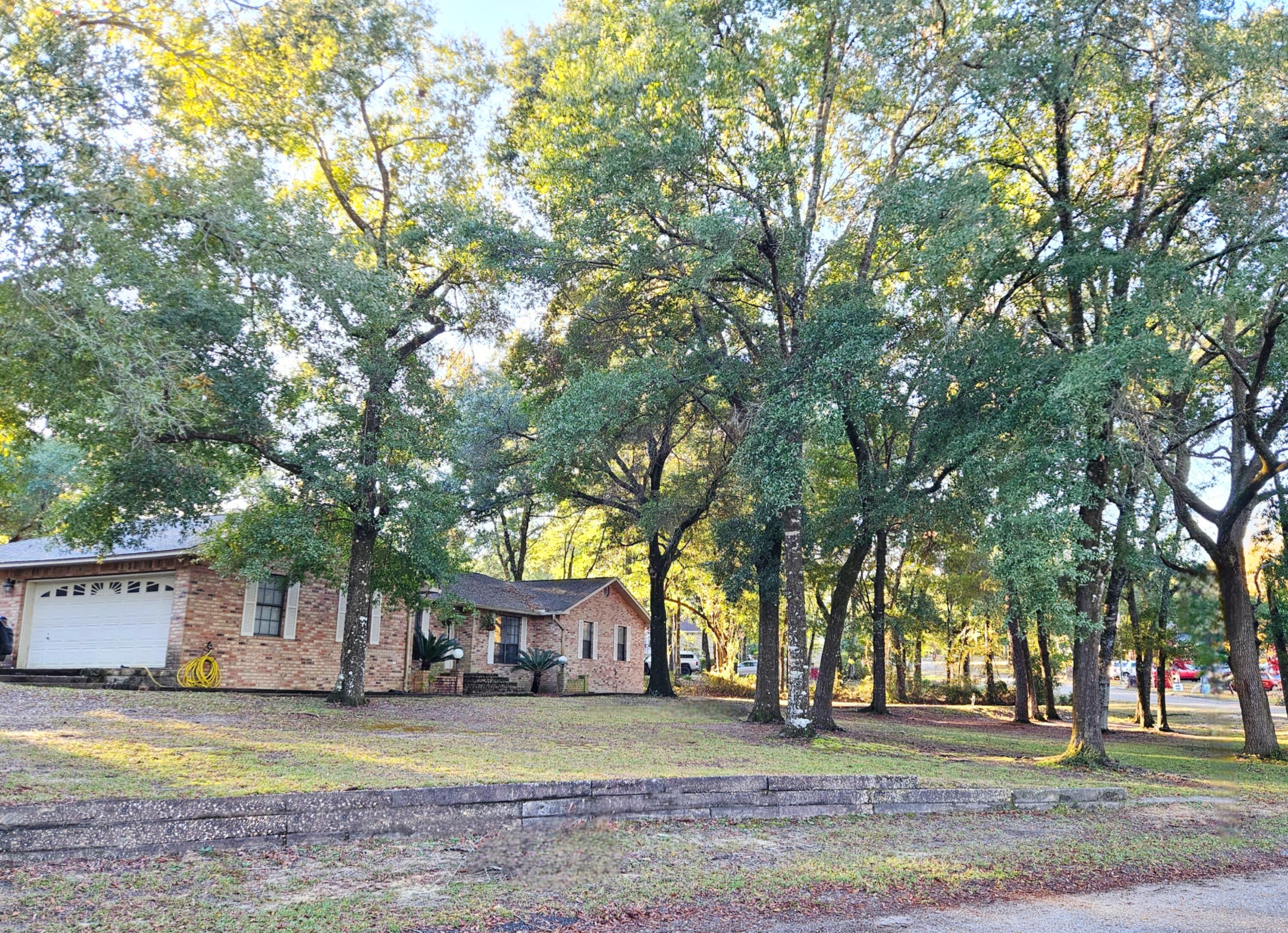 ATTENTION! 2 HOMES ON THIS ALMOST ACRE CORNER LOT!! The main house features 4 bedrooms, 3 bathrooms, and plenty of space/storage. The MIL apartment features a full bedroom, full bathroom, and a full size kitchen. There is an oversized RV parking pad with full hookups and a septic tank connection. This home offers an energy efficient geothermal heat pump new in 2022, a new roof in 2018, and the seller is offering an extended home warranty. There is a nice sized screened porch overlooking the large fenced in backyard. The community of Indian Trails offers lakes, docks, pavilions, and much more. As soon as you pull into this neighborhood...you feel like your home!Buyer to verify all facts deemed important.Main house offers 2313 SF plus 629 square feet in the MIL apartment